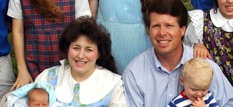 Michelle Duggar, 37, holds her 15th child, Jackson, who was born May 23, 2004. This family photo was taken on May 27th at the family's home in Springdale, Arkansas. In the back row, left to right, Jessa, 11; twins John David and Jana, 14; Jill, 13; and Joshua, 16. In the middle row, from left to right, Joy Anna, 6; Michelle with Jackson on her lap, Jim Bob, 38, with Justin, 18 months, in his lap, Jinger, 10; Josiah, 7 (striped shirt); Joseph, 9 (solid shirt, standing behind Josiah). Seated on the ground, left, James, 2; Jason, 4; and twins Jeremiah and Jedidiah