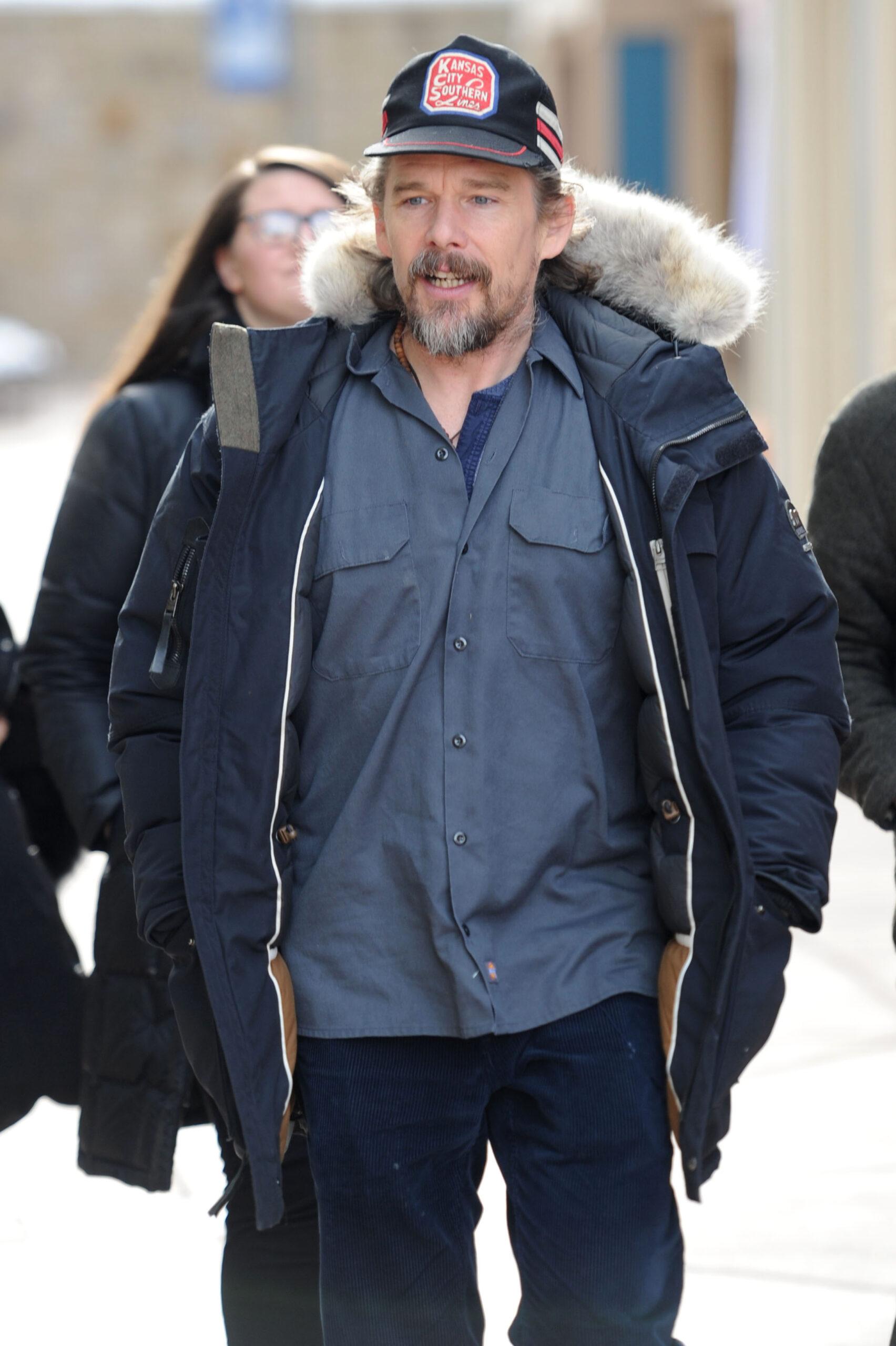 Ethan Hawke wears a baseball cap and winter jacket at the Sundance festival