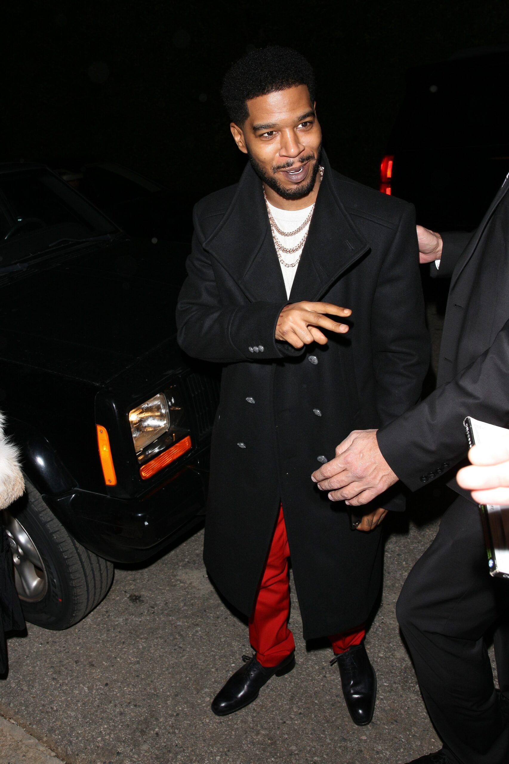 Rapper Kid Cudi and a female companion are spotted going to a WME Oscar party