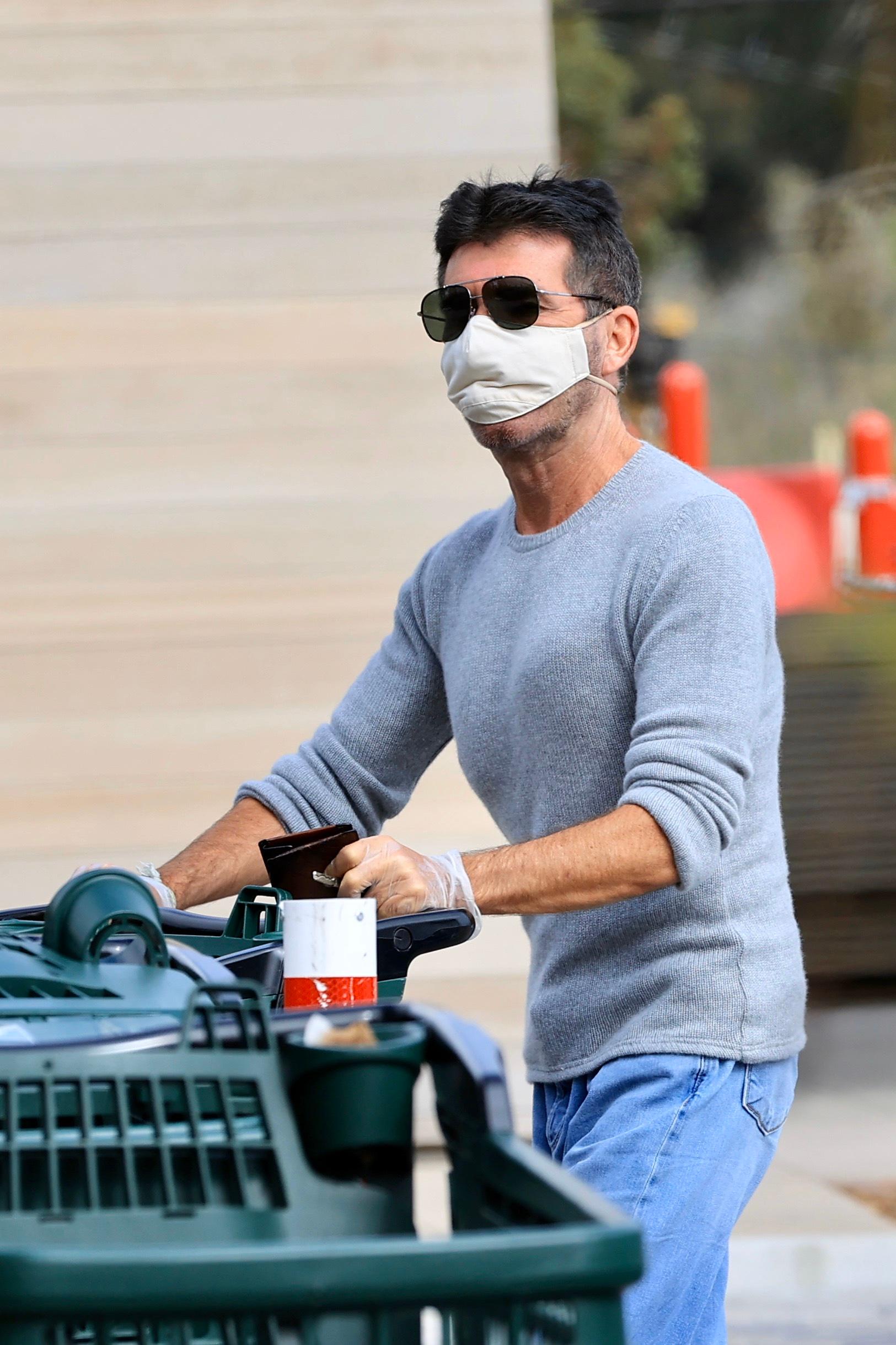 Simon Cowell wears a mask grocery shopping