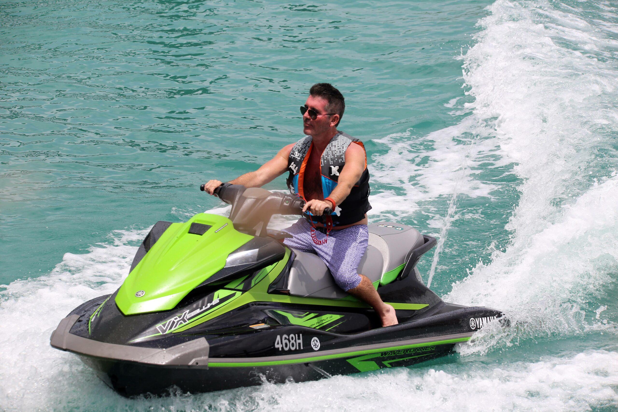 Simon Cowell takes a ride on a jet ski in Barbados