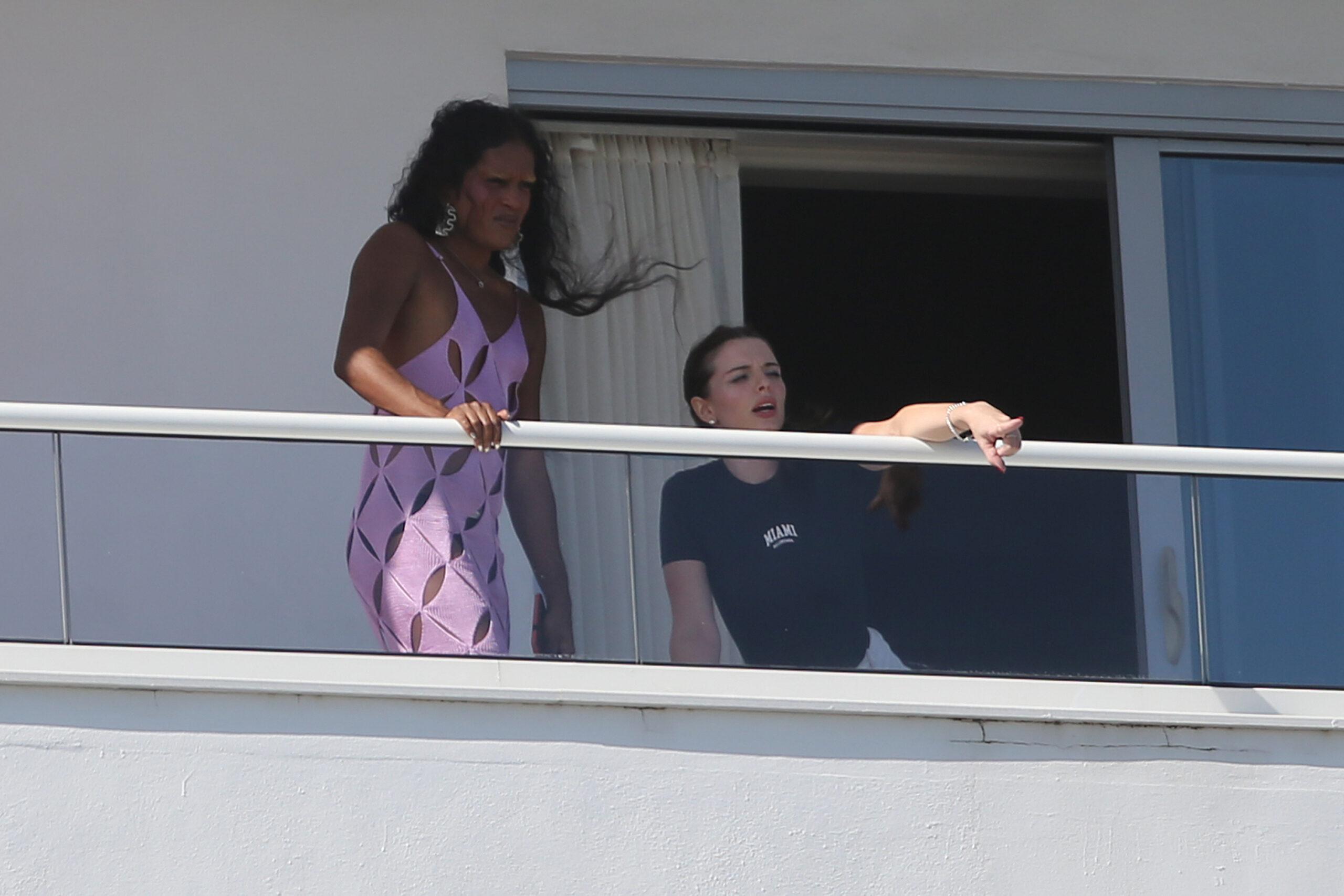 Actress Julia Fox is seen with a pal on Kanye West apos s hotel balcony the day after enjoying a romantic dinner date with the rapper