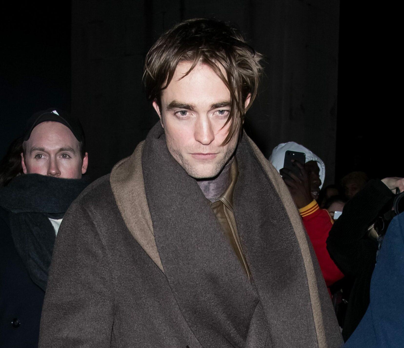 Robert Pattinson leaves the Dior fashion show