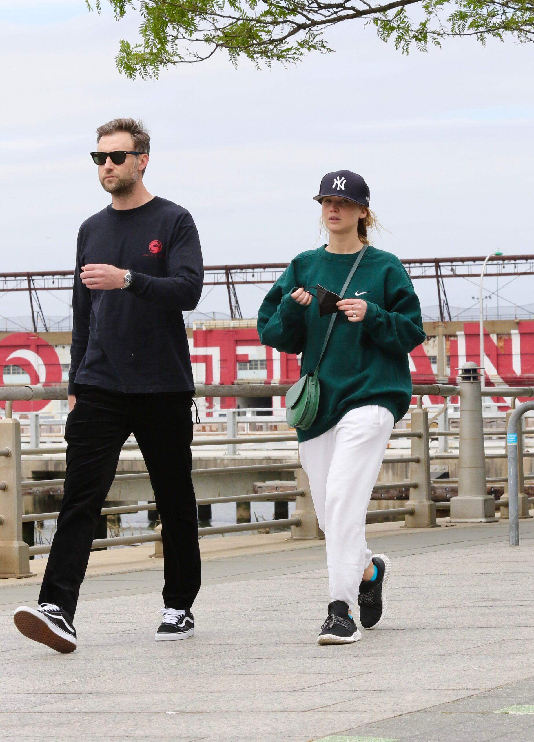Jennifer Lawrence in sweats goes on a power walk with husband Cooke Maroney in Manhattan’s Hudson River Park. The happy couple spent more than an hour walking along the riverfront. 24 May 2021 Pictured: Jennifer Lawrence and Cooke Maroney. Photo credit: LRNYC / MEGA TheMegaAgency.com +1 888 505 6342 (Mega Agency TagID: MEGA757256_001.jpg) [Photo via Mega Agency]