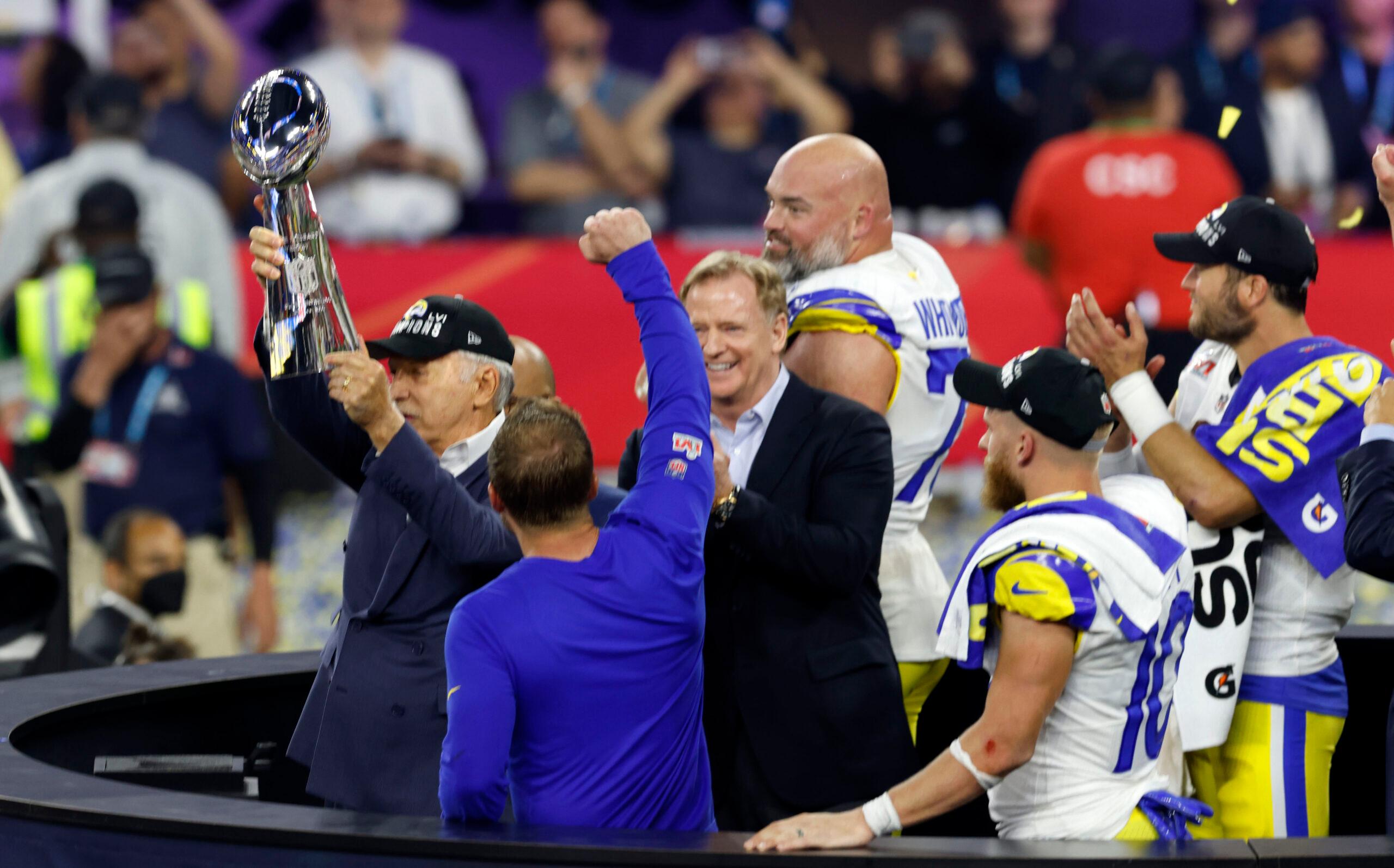Rams owner Stan Kroenke holds the Super Bowl trophy