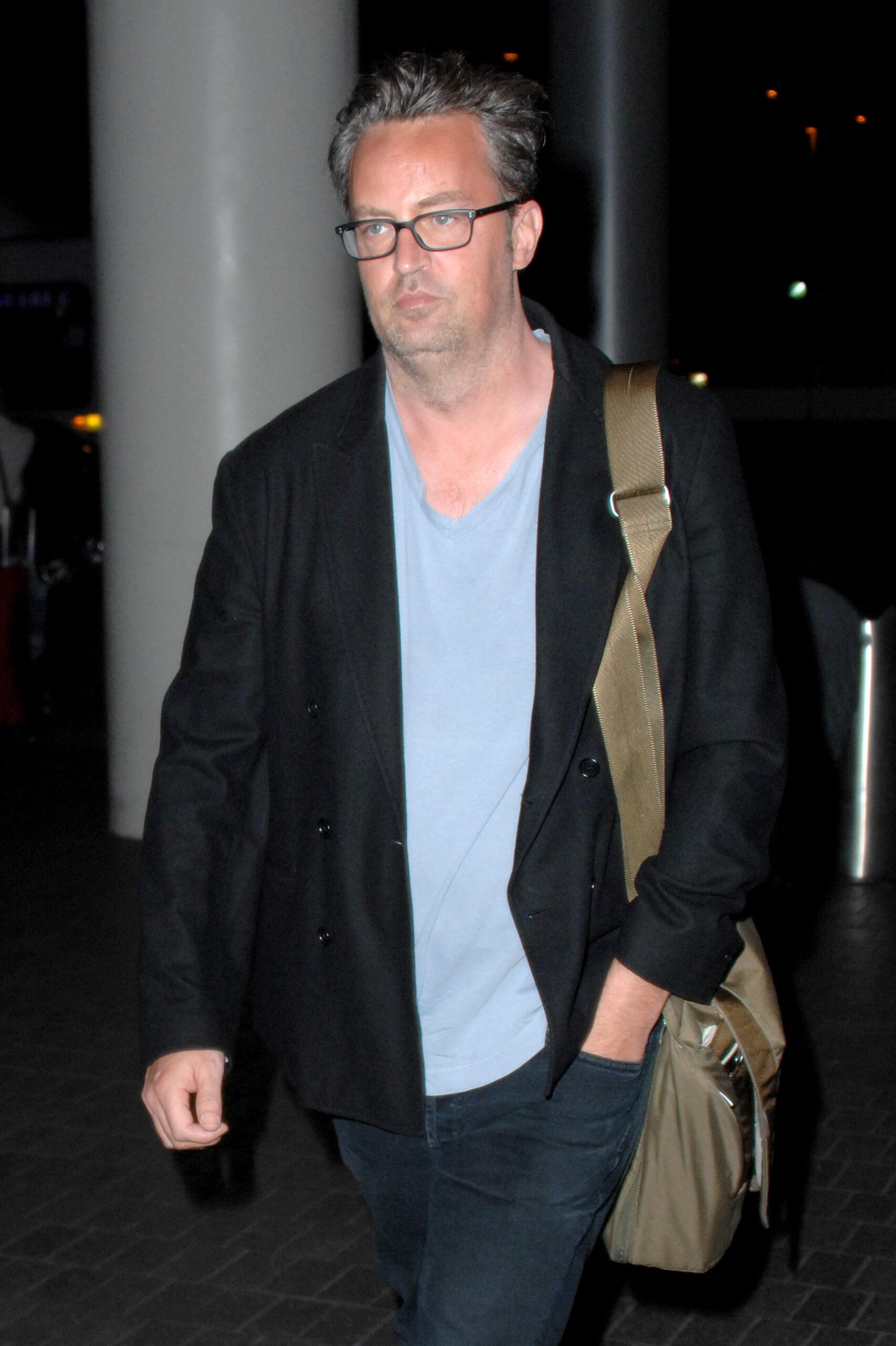 Matthew Perry shows off a fuller figure and double chin as he arrives at LAX airport