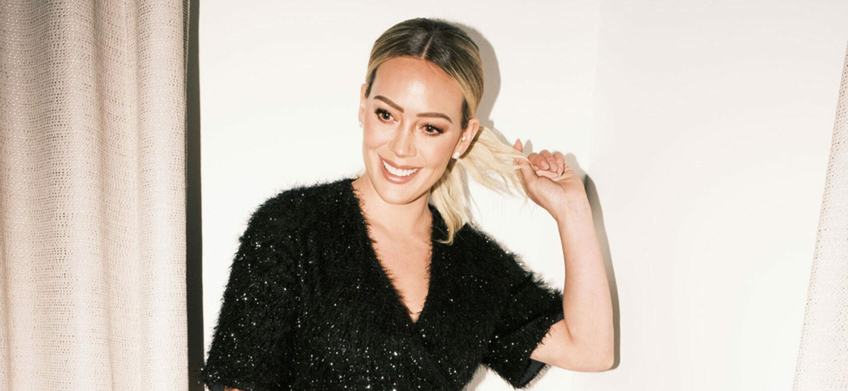 Hilary Duff shows off her shapely legs and dazzles in festive tinsel Smash Tess romper
