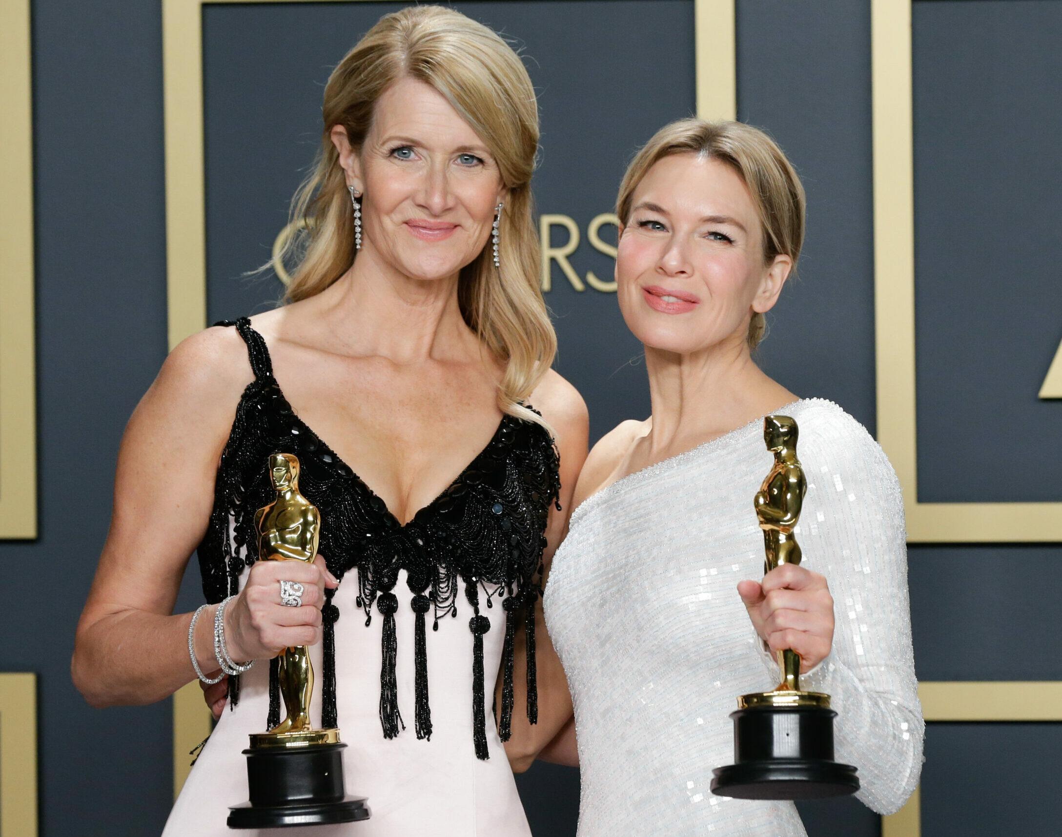 Laura Dern (L), winner of Best Actress in a Supporting Role for "Marriage Story," and Renée Zellweger, winner of Best Actress in a Leading Role for "Judy," appear backstage with their Oscar