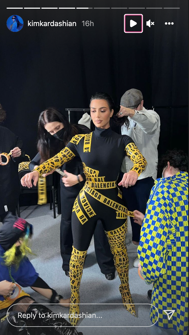 Kim Kardashian being taped into an outfit