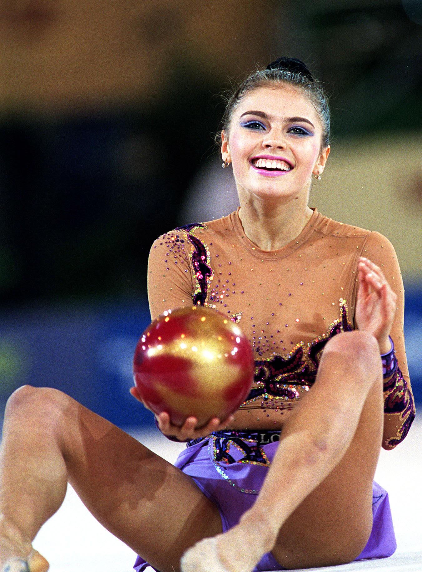 Alina Kabaeva of Russia reacts after her performance with the ball during the World Rhythmic Gymnastics Championships in Madrid October 21, 2001. Kabaeva won the gold medal. (Miguelez Sport/iPhoto.ca) (File size:7.07Mb) MADSPA10210102 Newscom/(Mega Agency TagID: iphotos004104.jpg) [Photo via Mega Agency]