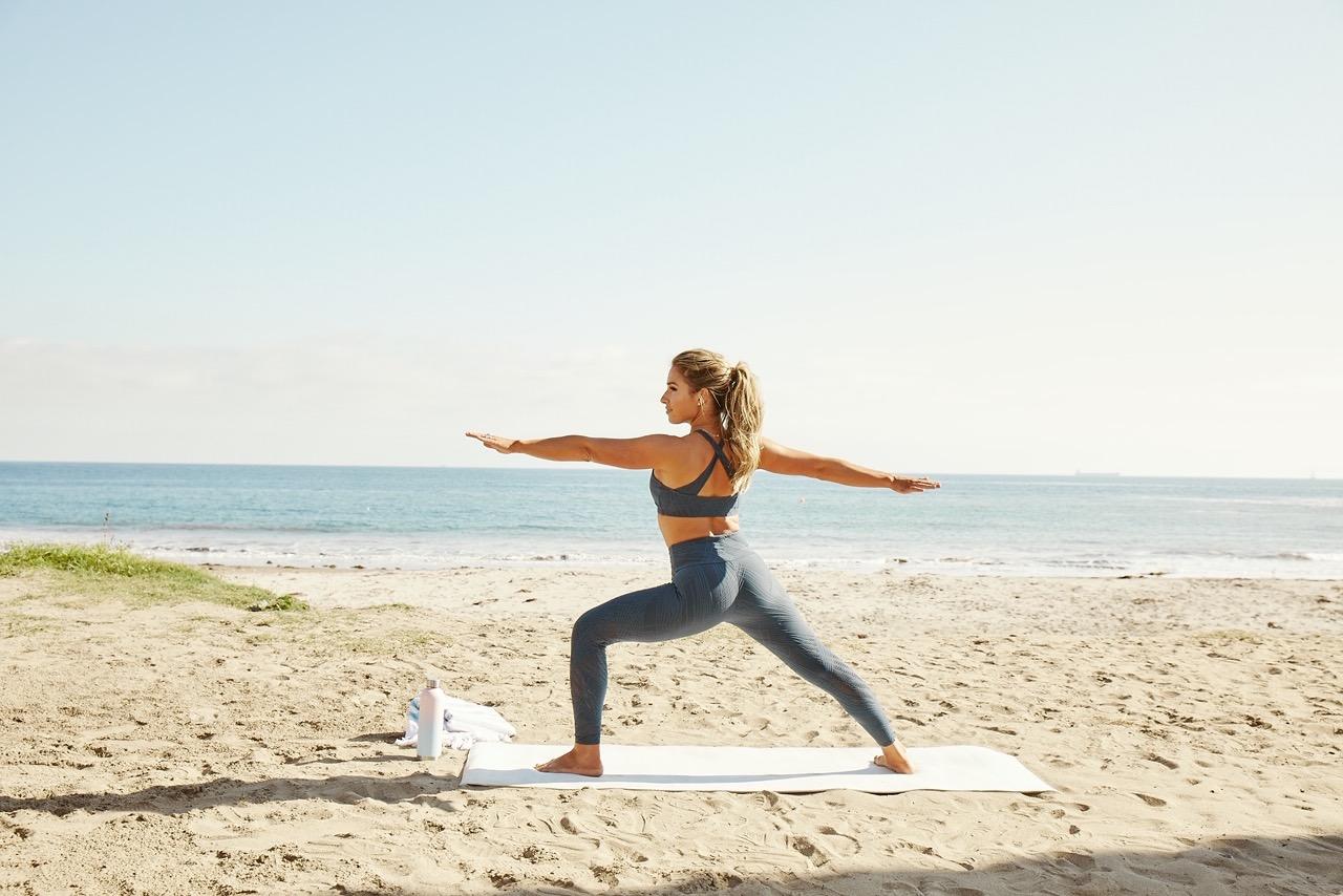 Jessie James Decker flaunts her curves in daring black swimsuit as she gets into the yoga flow