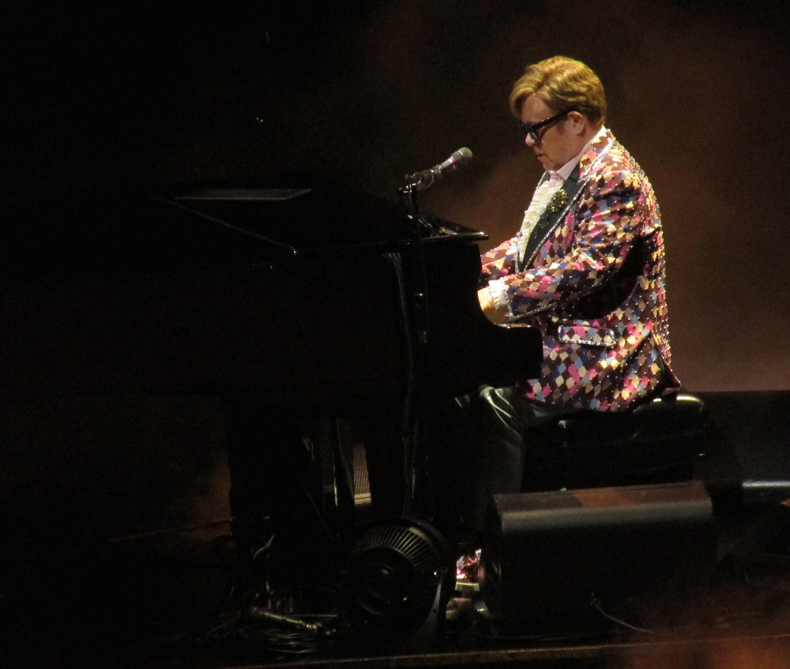 Elton John waves to the crowd as he changes three times during his finals shows in NYC