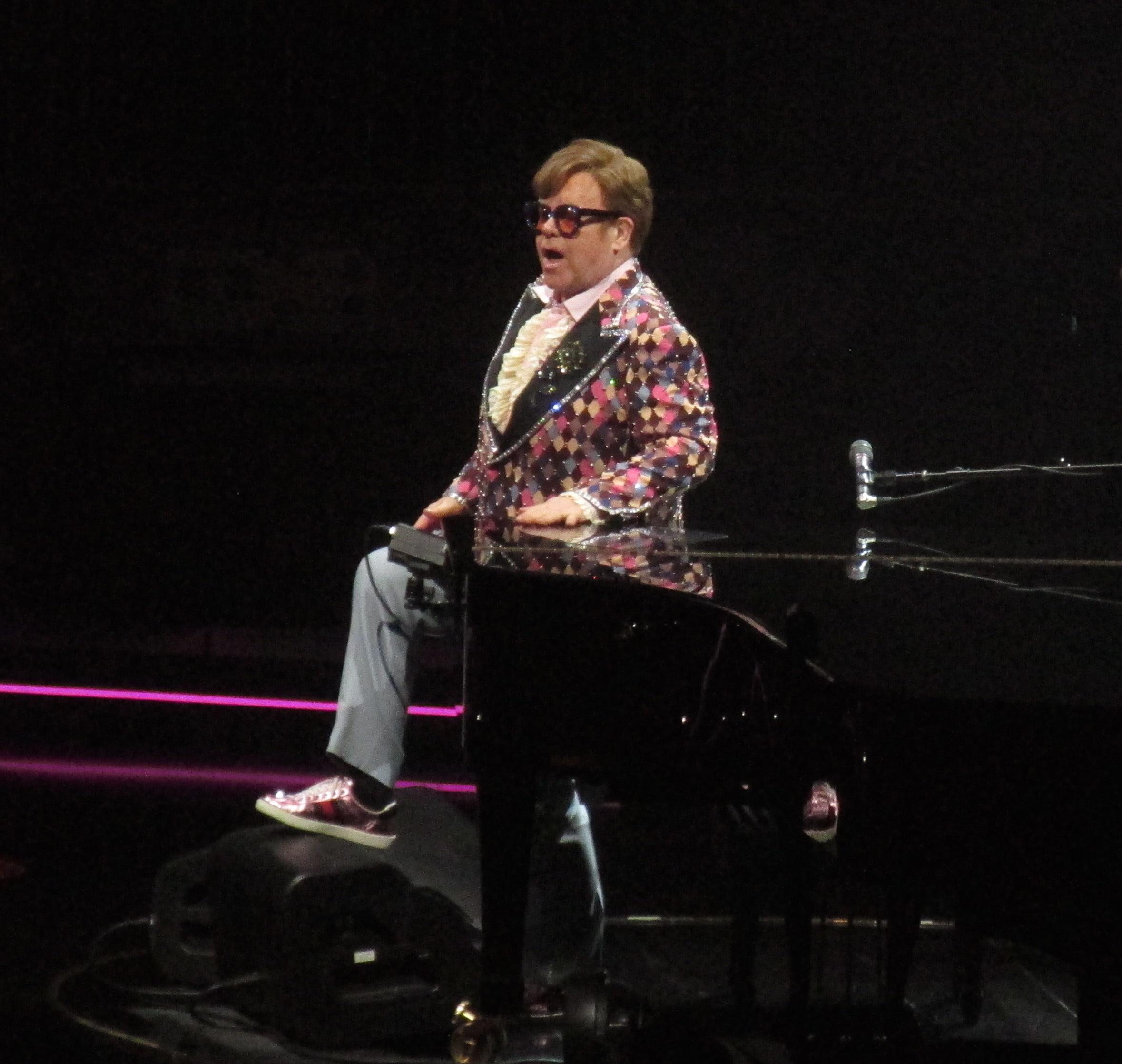 Elton John waves to the crowd as he changes three times during his finals shows in NYC