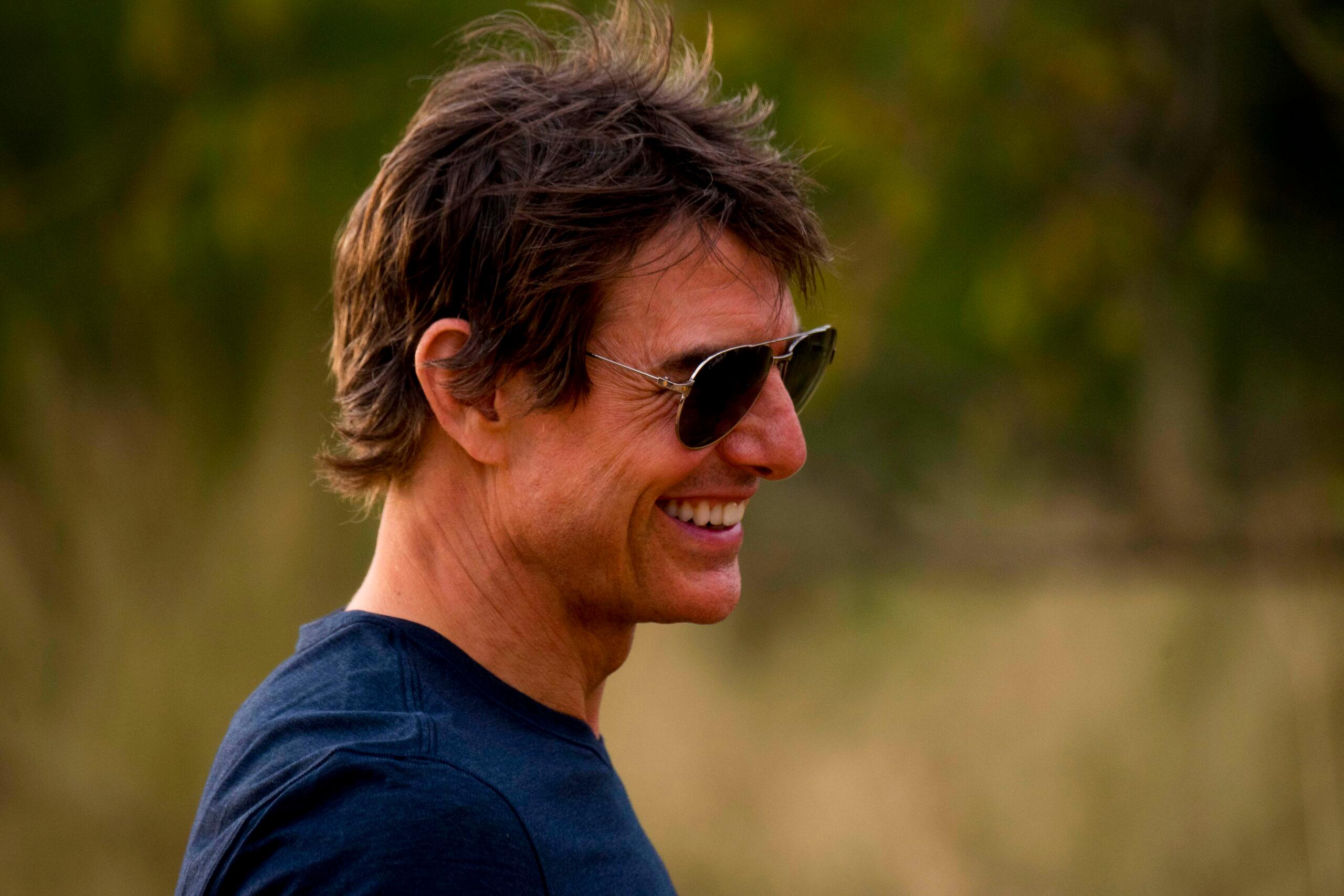 Impressed Tom Cruise reacts to being serenaded with the Top Gun theme song by fans in South Africa