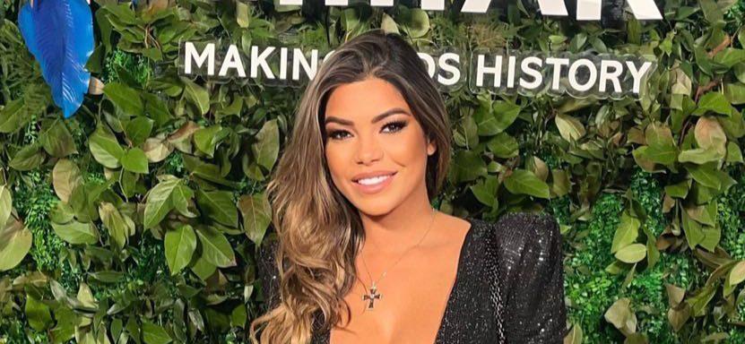 Suelyn Medeiros and celeb plastic surgeon boyfriend Garth Fisher pose as she shows off her curves in low cut dress for charity event in Miami