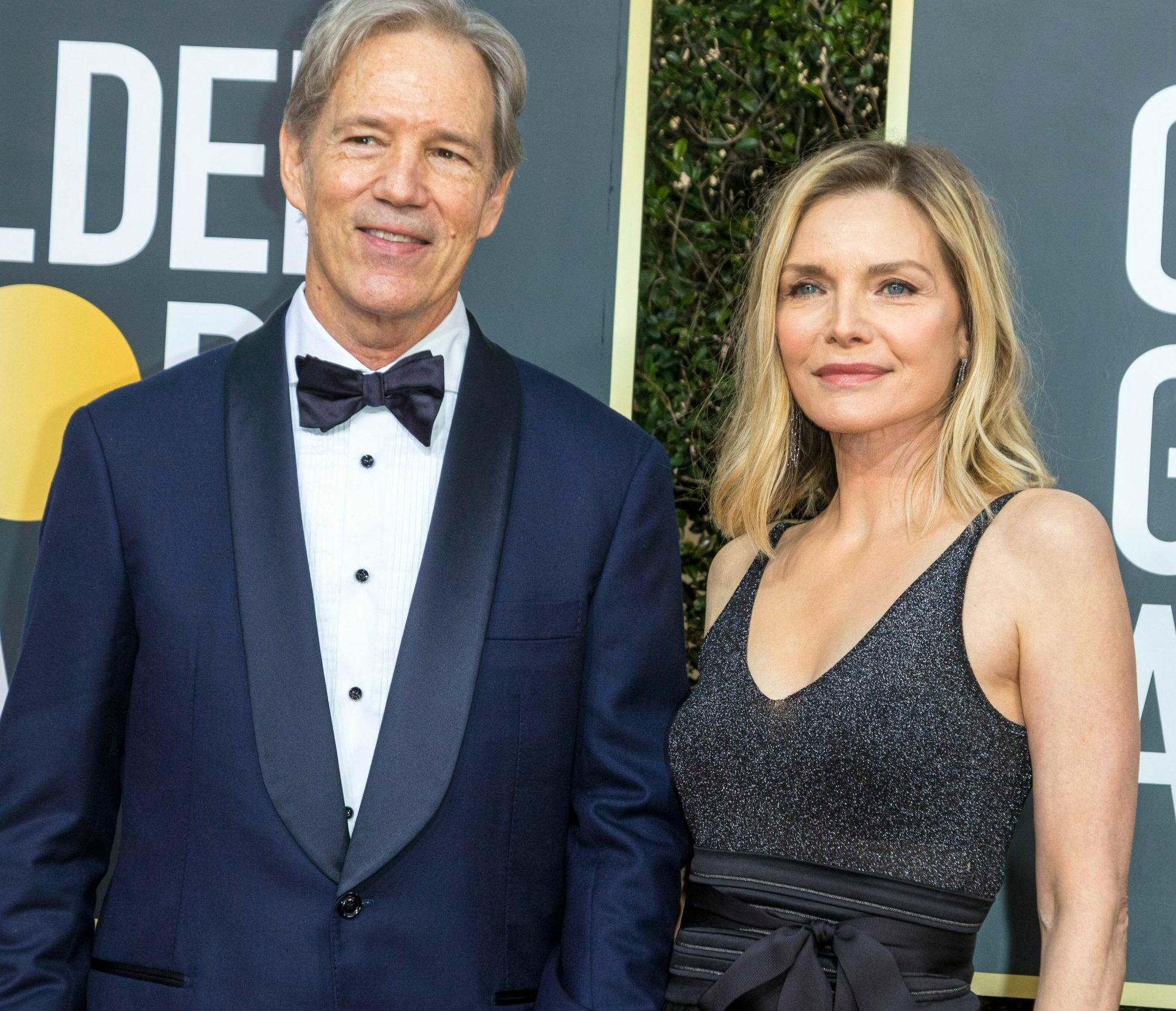 David E. Kelley and Michelle Pfeiffer attend the 77th Annual Golden Globe Awards