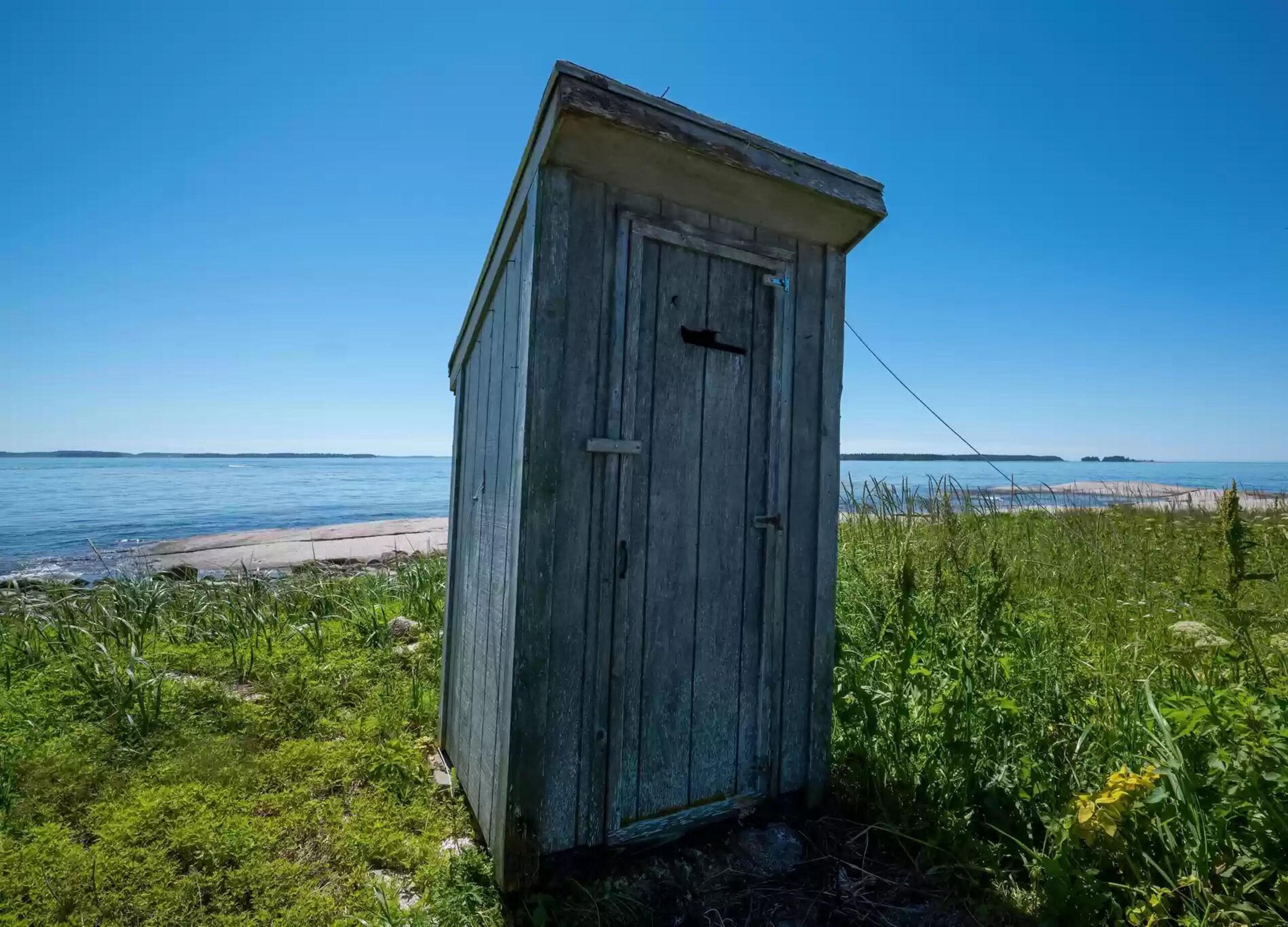 Remote private island with tiny cottage, outdoor toilet and no shower in chilly Maine on the market for $339,000