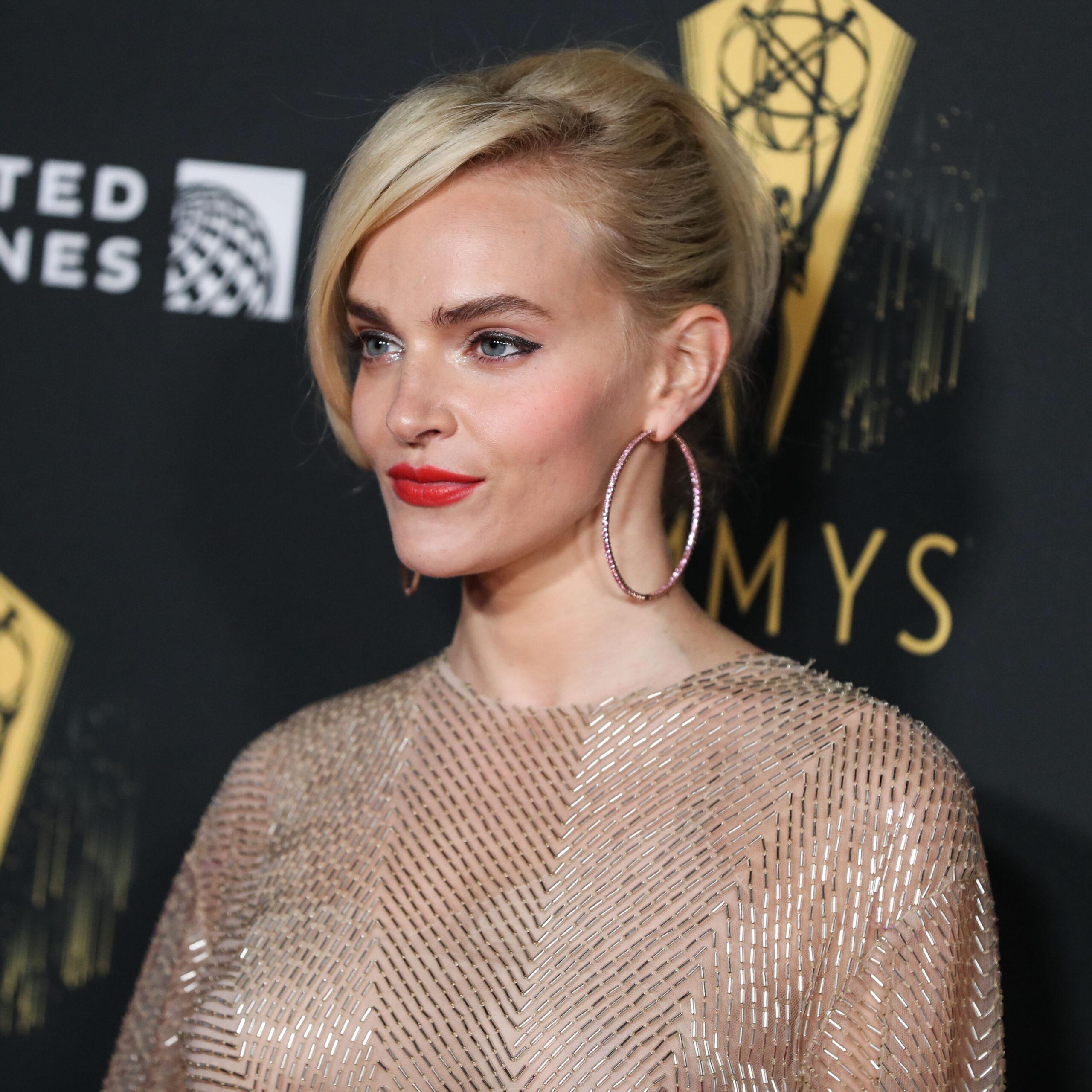 Madeline Brewer wearing a Valentino dress, Alexandre Birman shoes and Kallati earrings arrives at the Television Academy's Reception To Honor 73rd Emmy Award Nominees