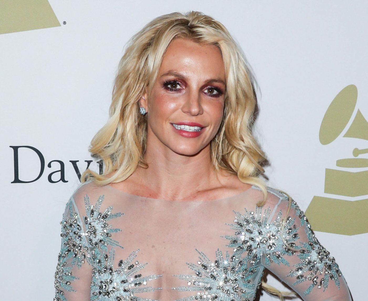 Singer Britney Spears wearing a custom Uel Camilo dress, Loriblu shoes and bag, and a Jen Hansen ring arrives at The Recording Academy And Clive Davis' 2017 Pre-GRAMMY Gala held at The Beverly Hilton Hotel on February 11, 2017 in Beverly Hills, Los Angeles, California, United States.