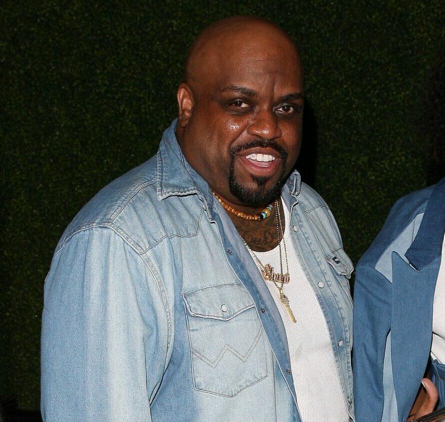 American singer CeeLo Green and his girlfriend are color coordinated in denim as they are spotted leaving the Delilah Restaurant