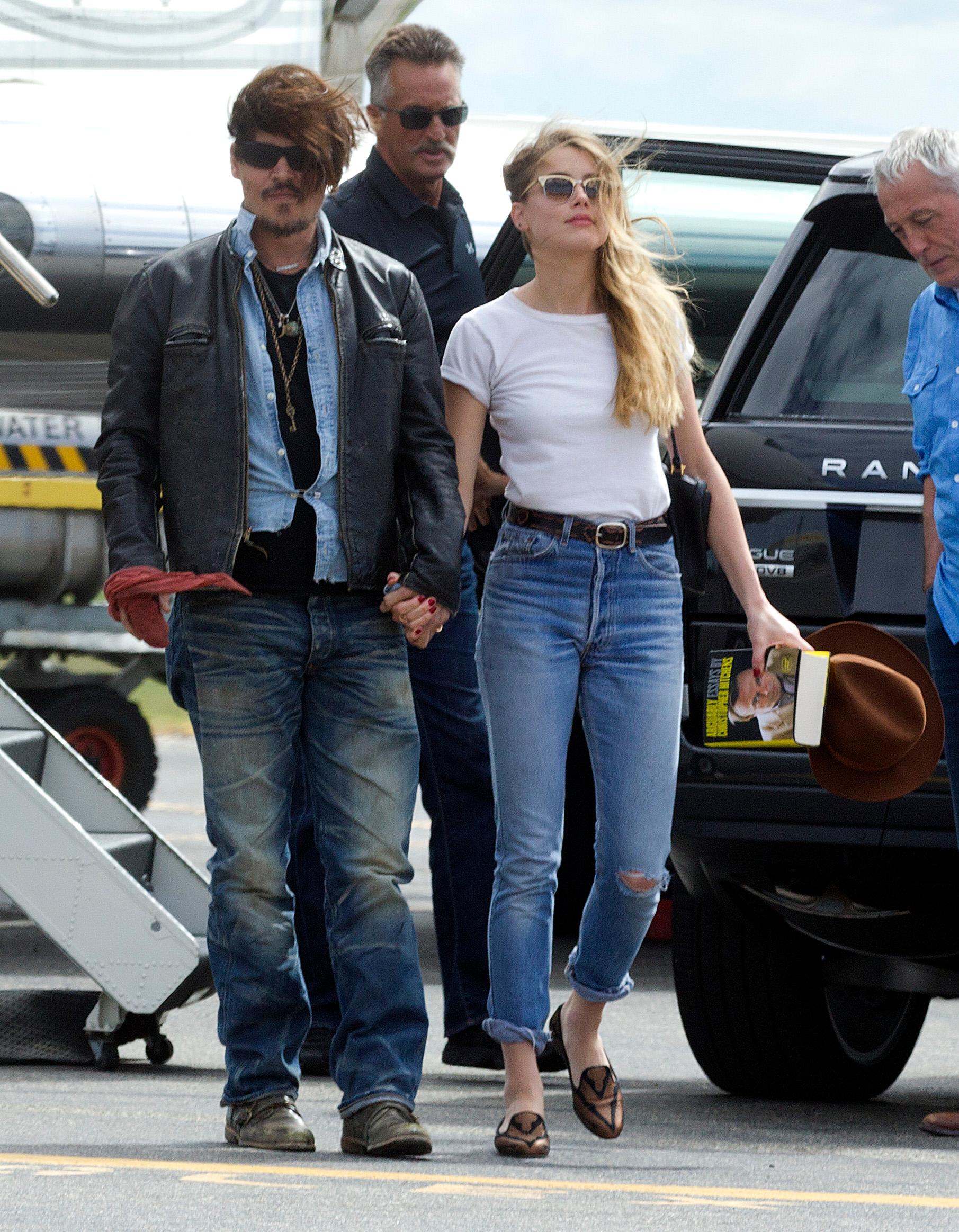 Johnny Depp with his then wife Amber Heard arrive back in Australia