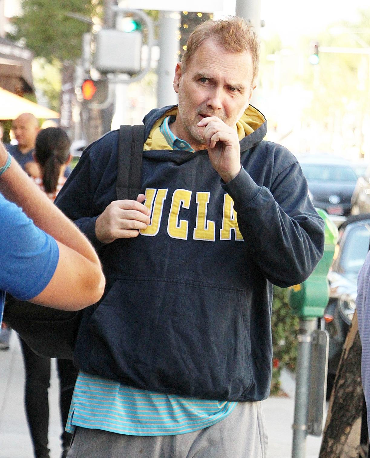 Canadian comedian Norm MacDonald seen wearing UCLA sweat shirt