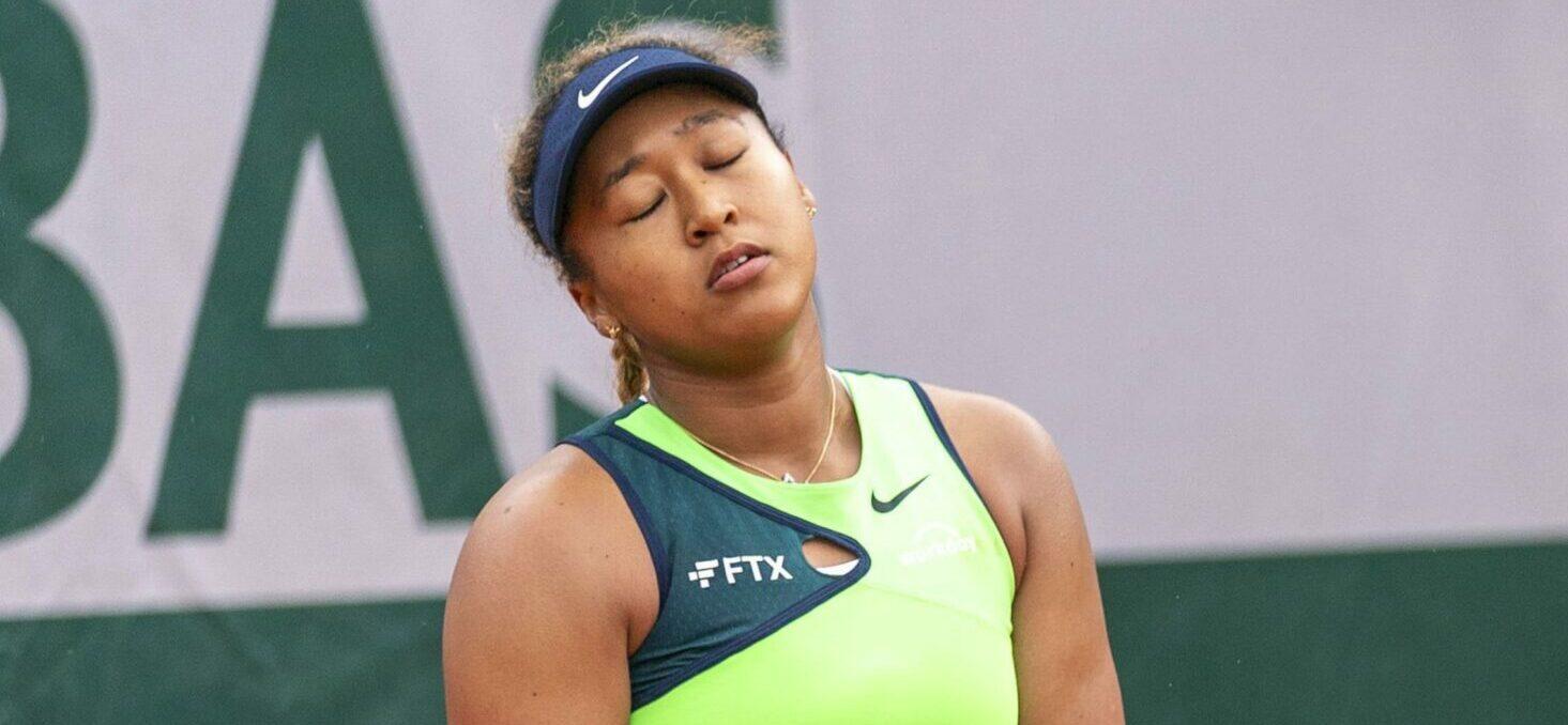 Naomi Osaka of Japan reacts after losing a point to Amanda Anisimova of the United States during their first-round match at the French Open tennis tournament in Paris on May 23, 2022.