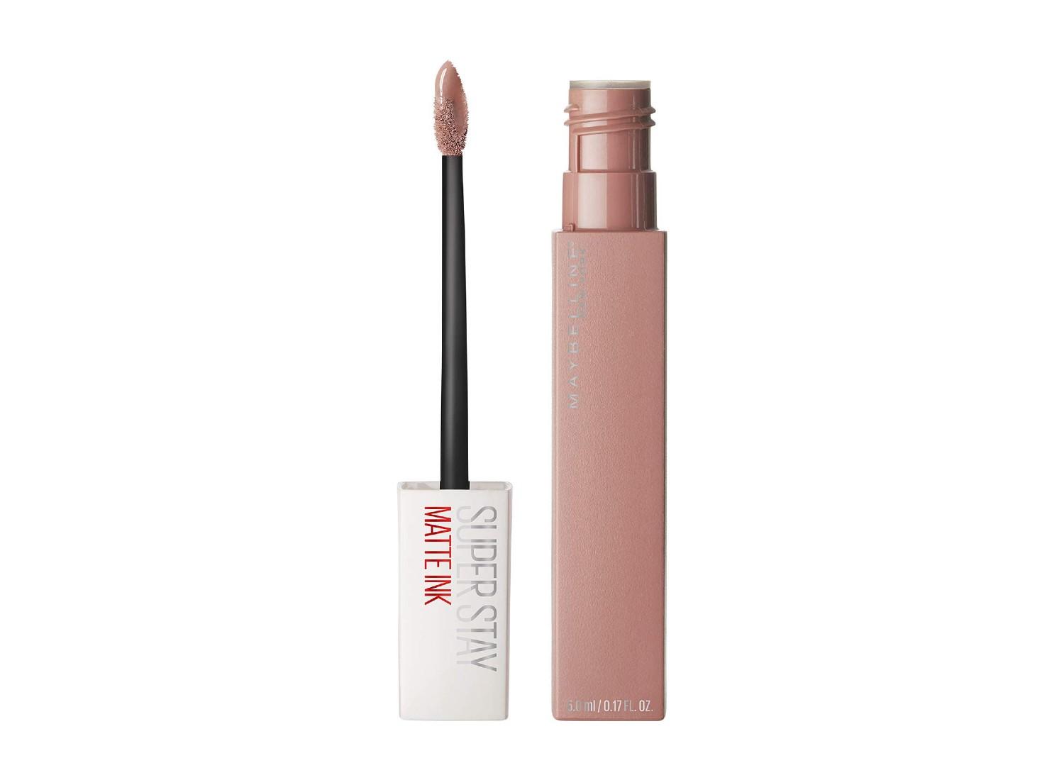 An open bottle and applicator of Maybelline lipstick.