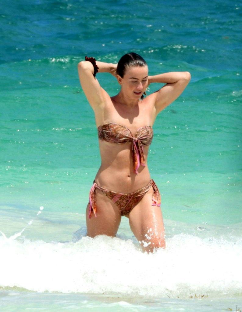 Bikini-clad Julianne Hough looks stunning as she goes for a swim in Mexico