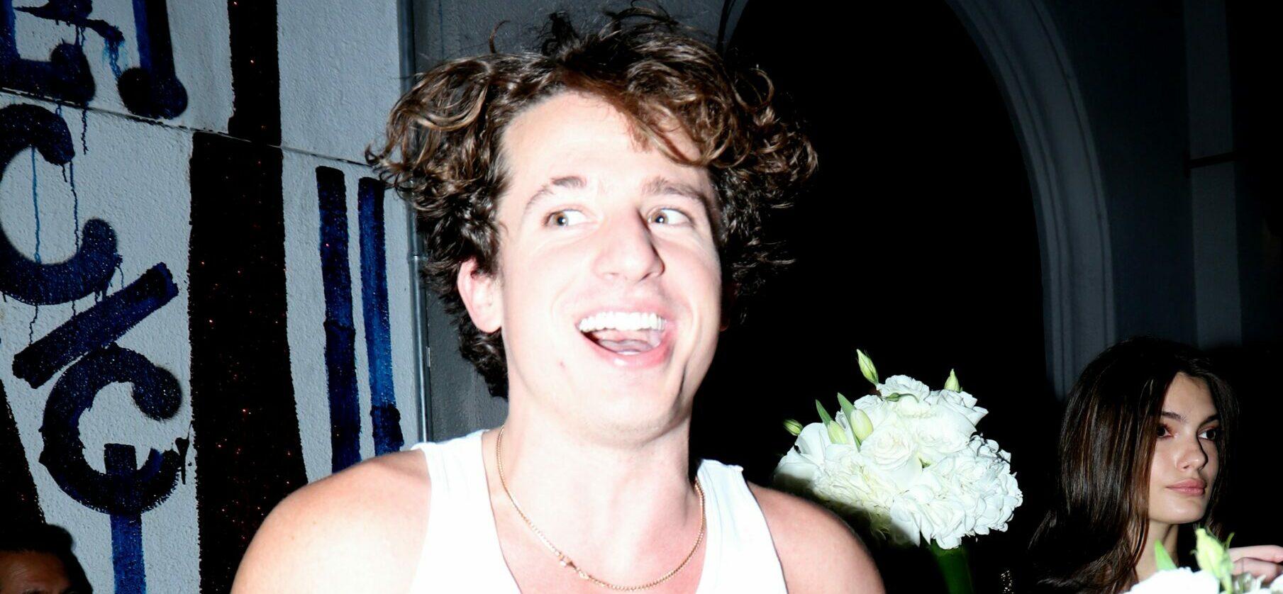 Charlie Puth helps friend carry out flower bouquets from dinner party at Craig apos s