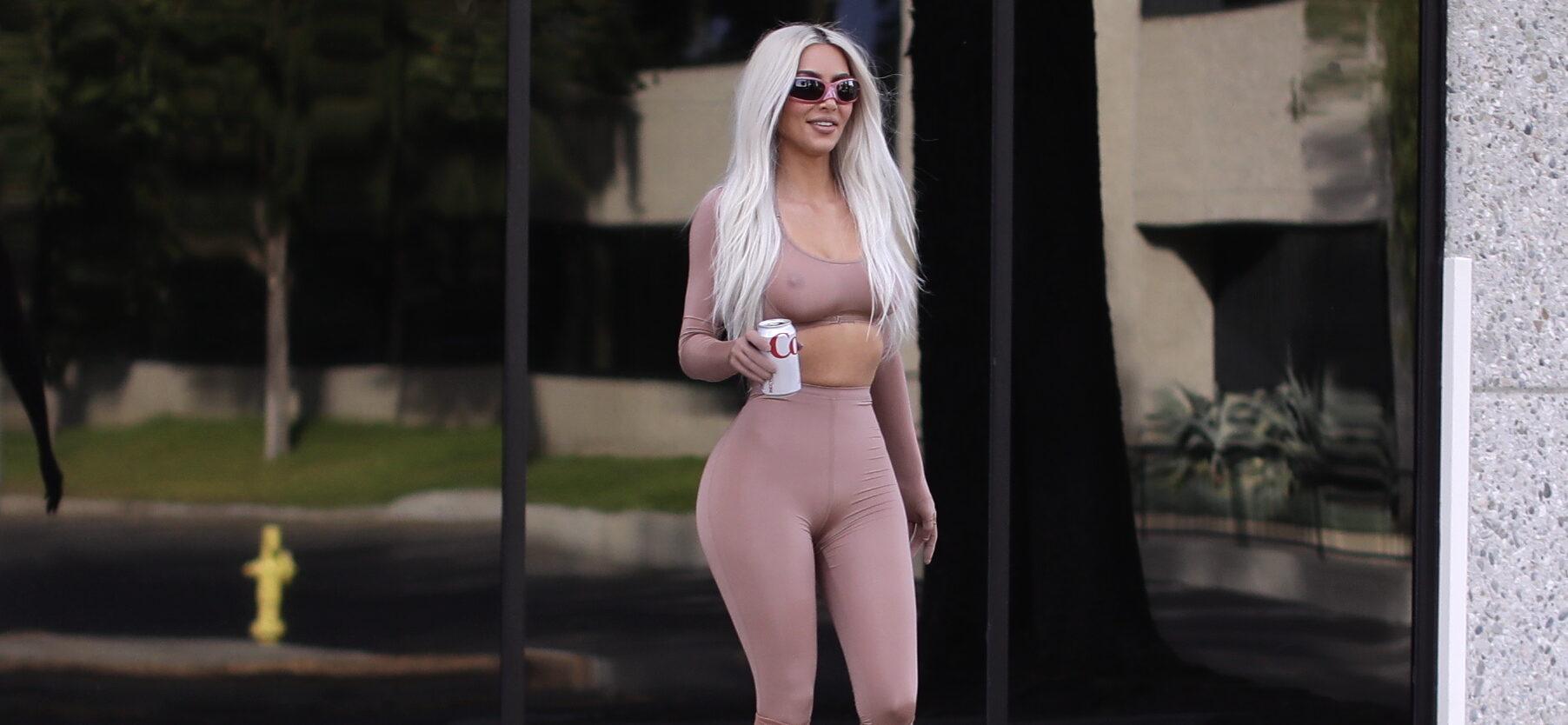 Kim Kardashian is all smiles as she shoot for her SKIMS line at a studio as she is joined by Pete Davidson briefly and glam squad in LA