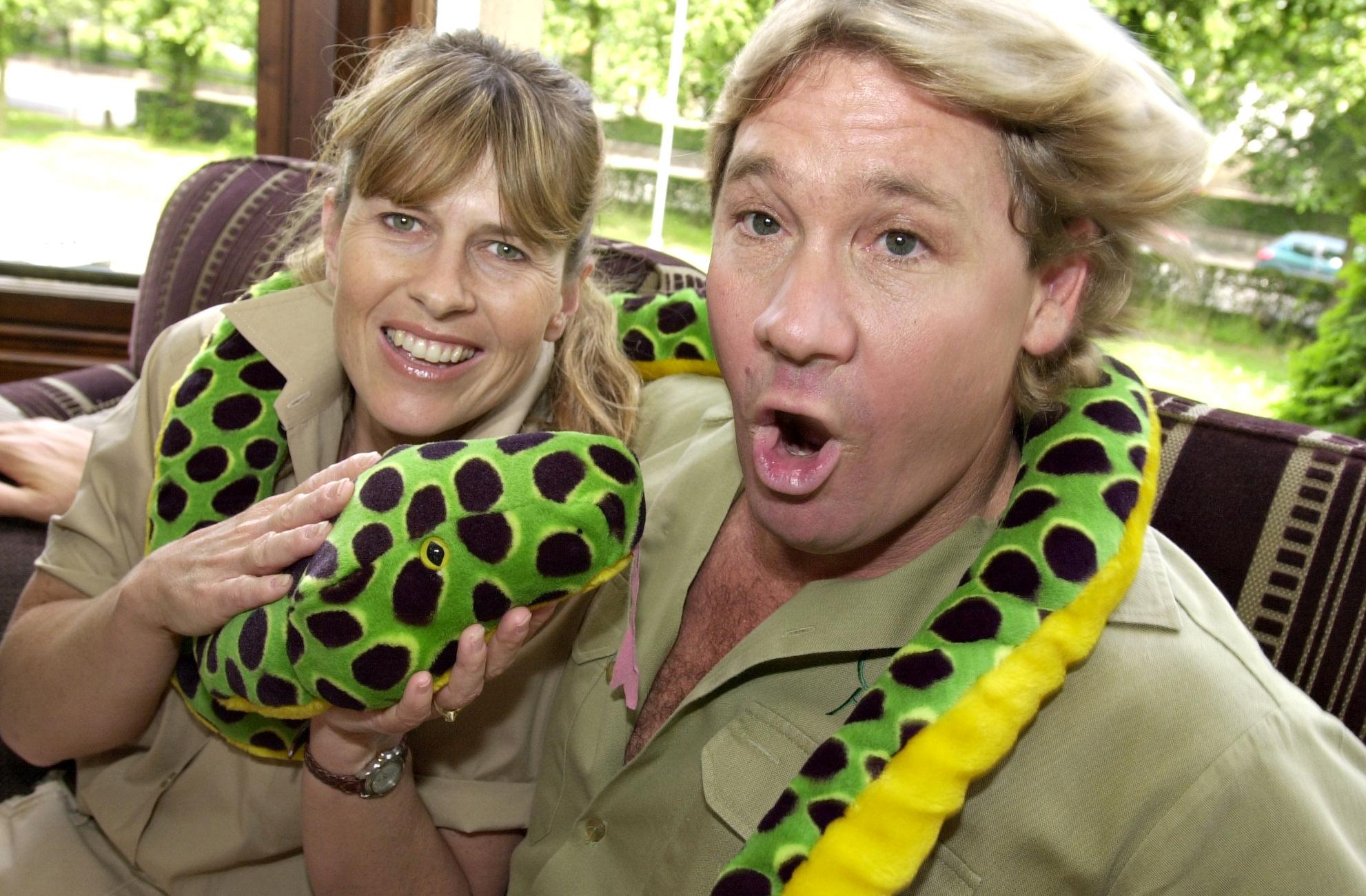 Terri Irwin & Steve Irwin with toy snake in July 2002