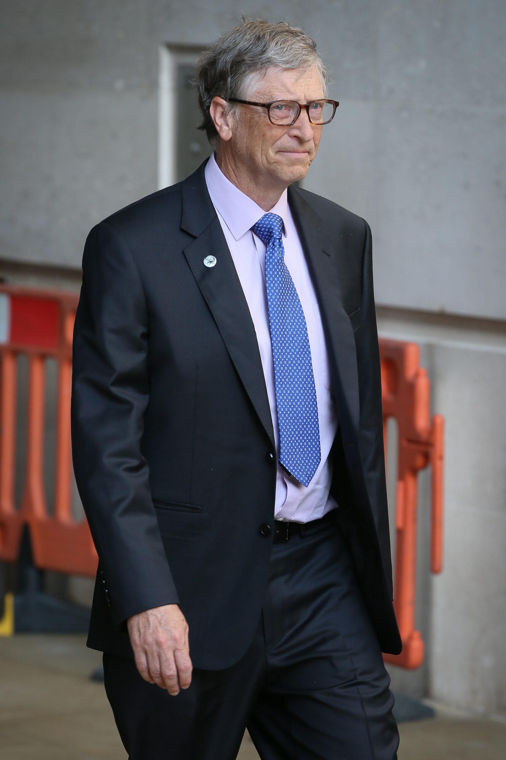 Bill Gates leaving BBC Radio Studios after being interviewed fighting against malaria - London