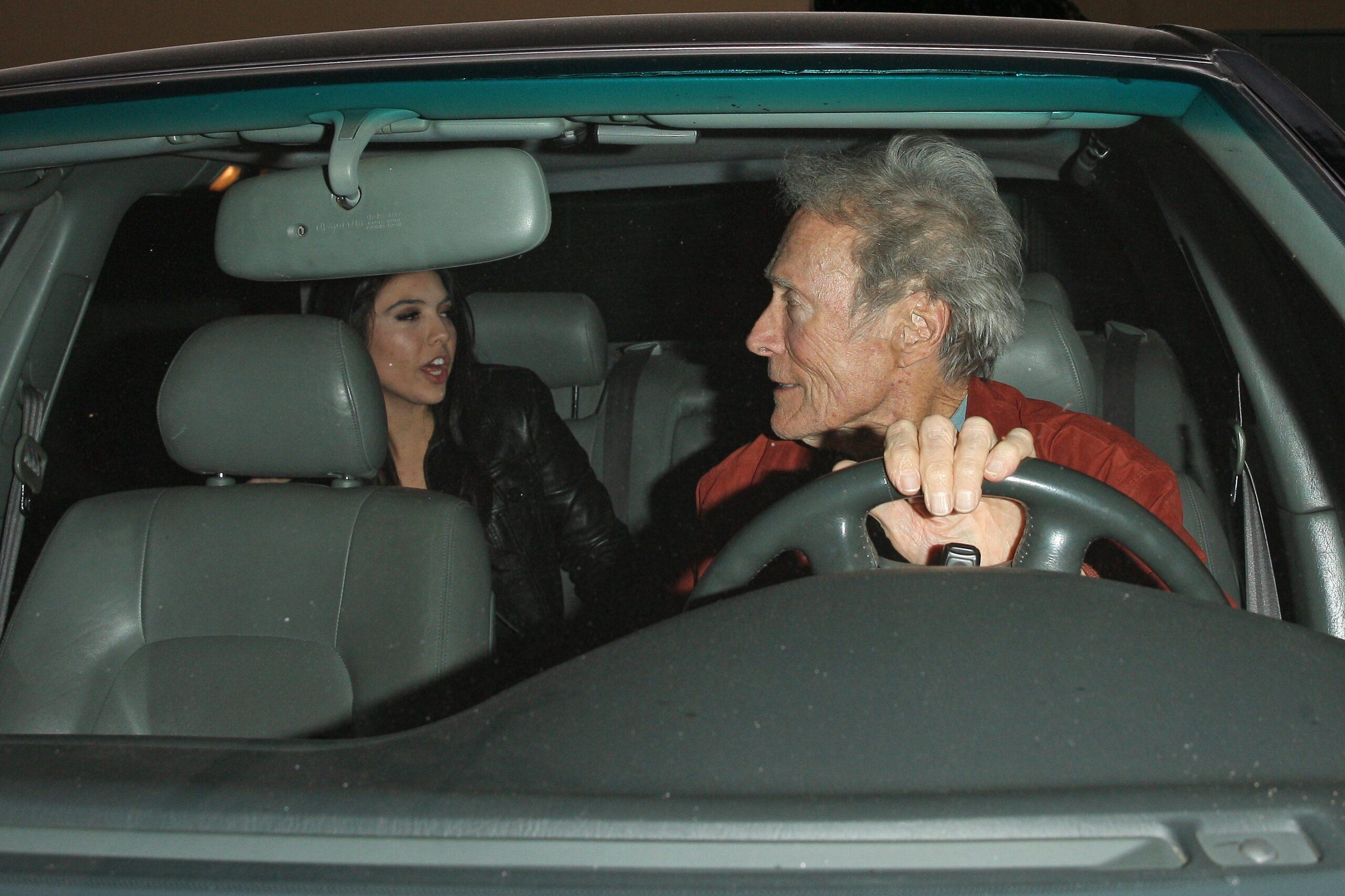 Actor Clint Eastwood 88 is spotted leaving LA hot spot Craig apos s with Mick Jagger apos s former fling Noor Alfallah 23