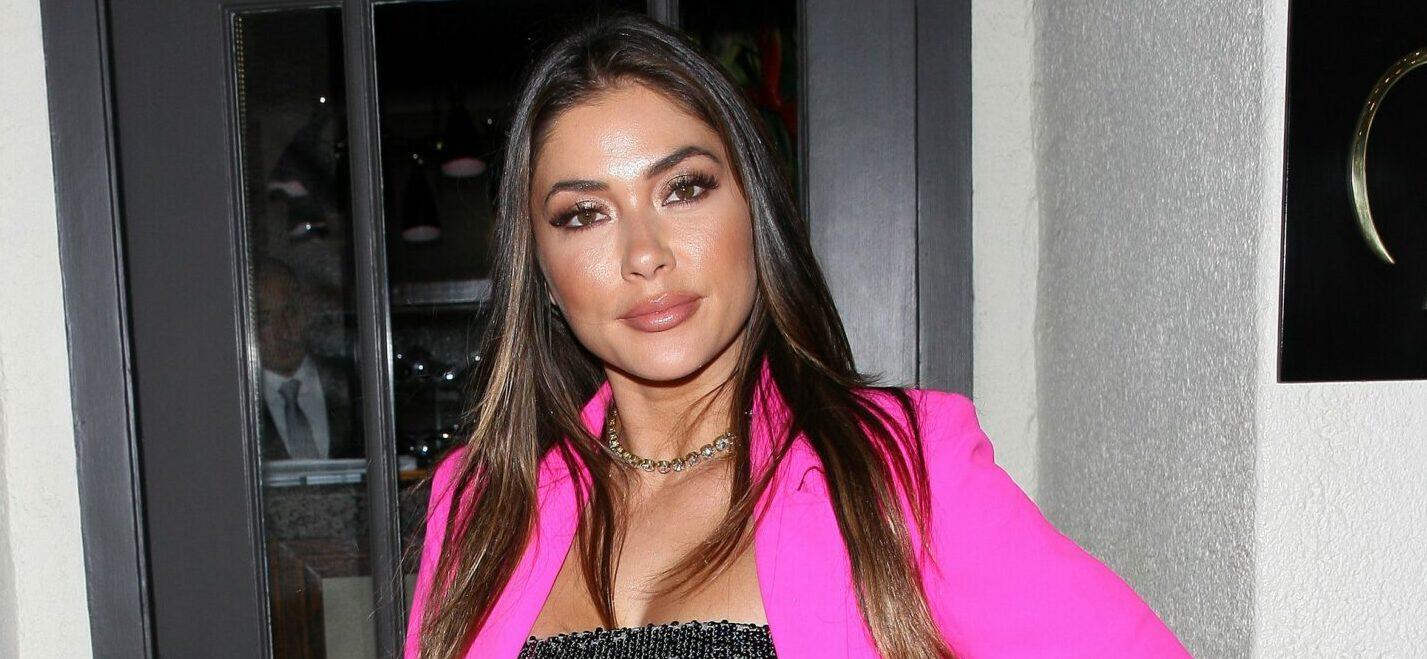 Model Arianny Celeste sports a hot pink jacket as she heads to Madeo restaurant