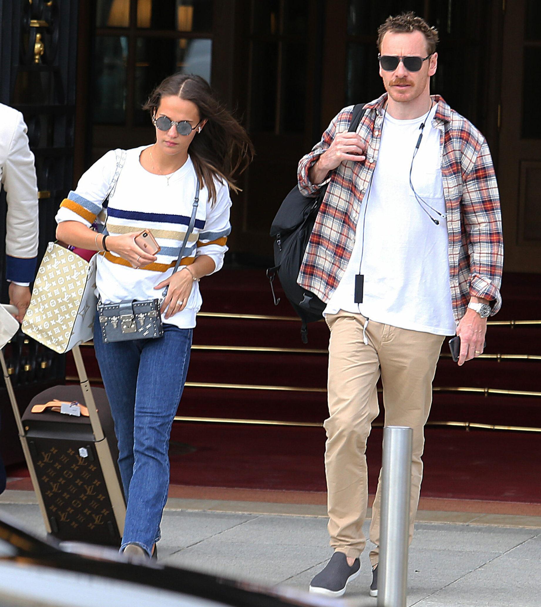 Alicia Vikander and Michael Fassbender leave their hotel in Paris