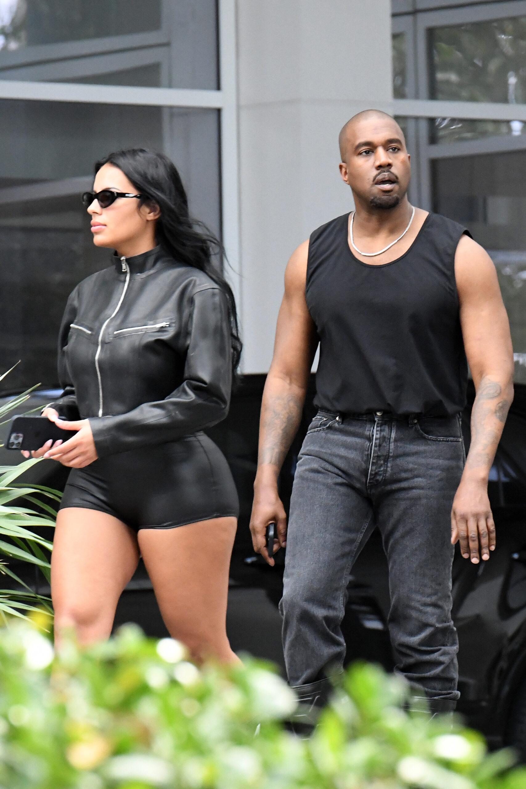 A newly single Kanye West is seen leaving his hotel with new girlfriend Chaney Jones in Miami