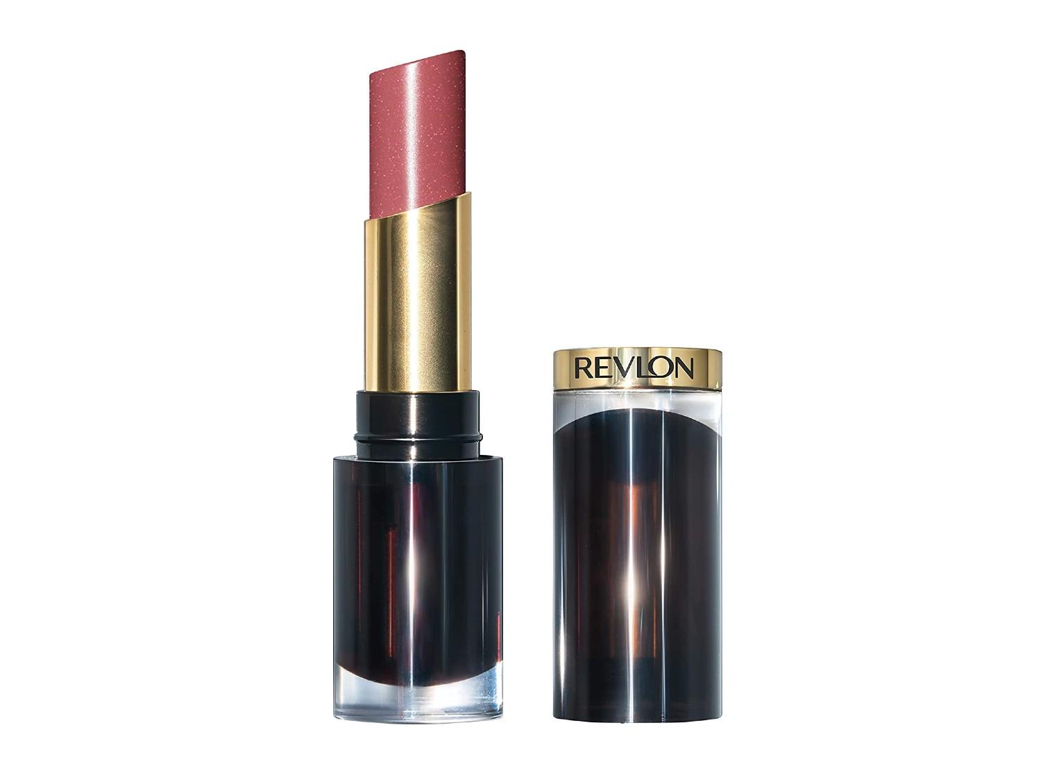An open Revlon lipstick and its cap on a white background.