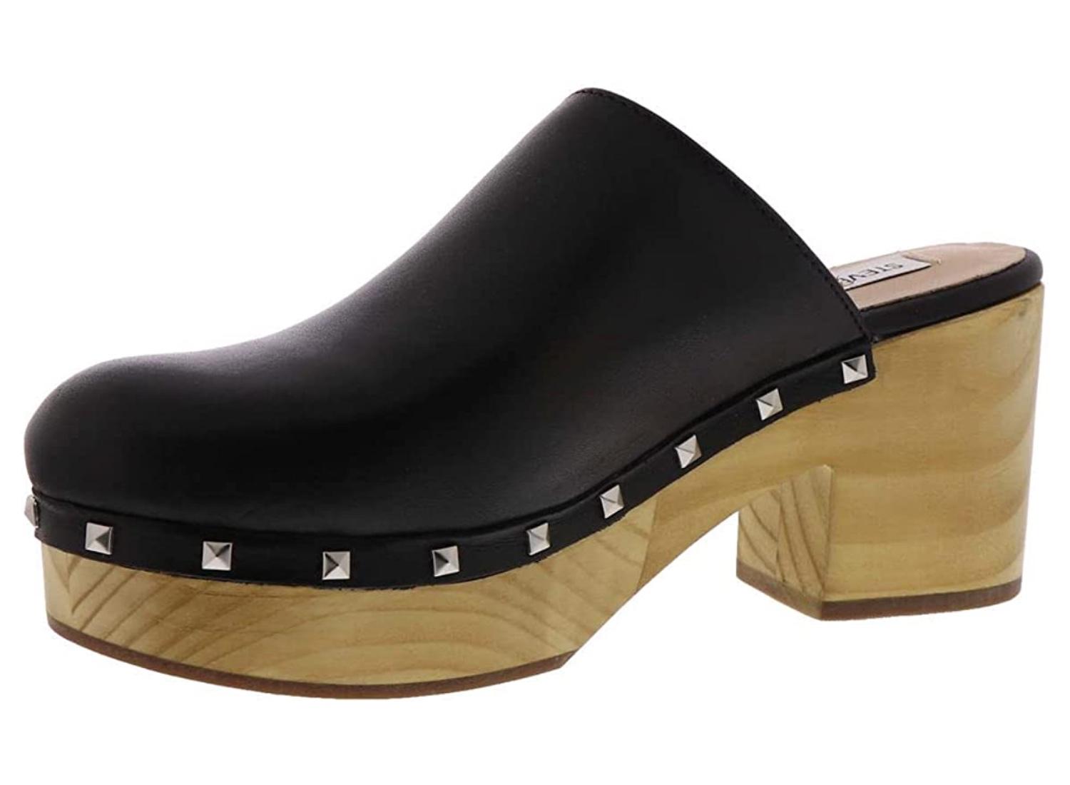 Black leather clog with small studs lining the base and a wood-like block heel