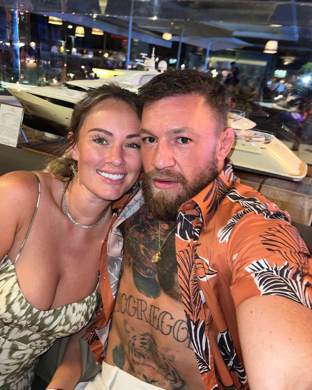 Conor McGregor and Dee Devlin pose for the camera.