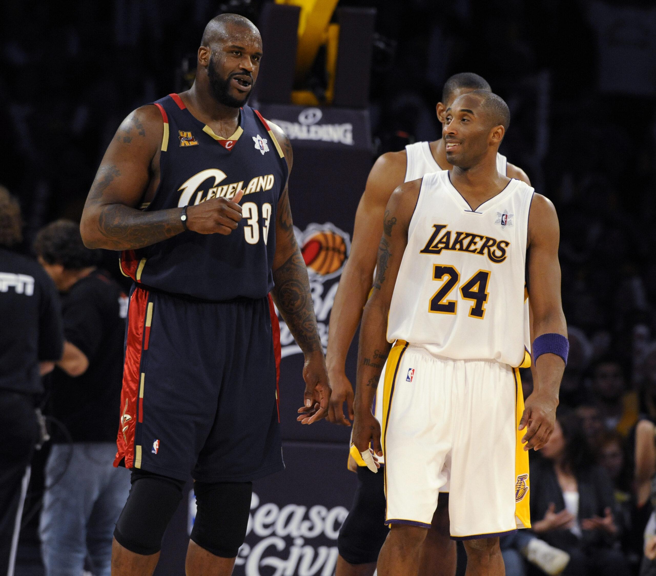 Kobe Bryant and Shaquille O'Neal talk during the second half of an NBA basketball game in Los Angeles on December 25, 2009