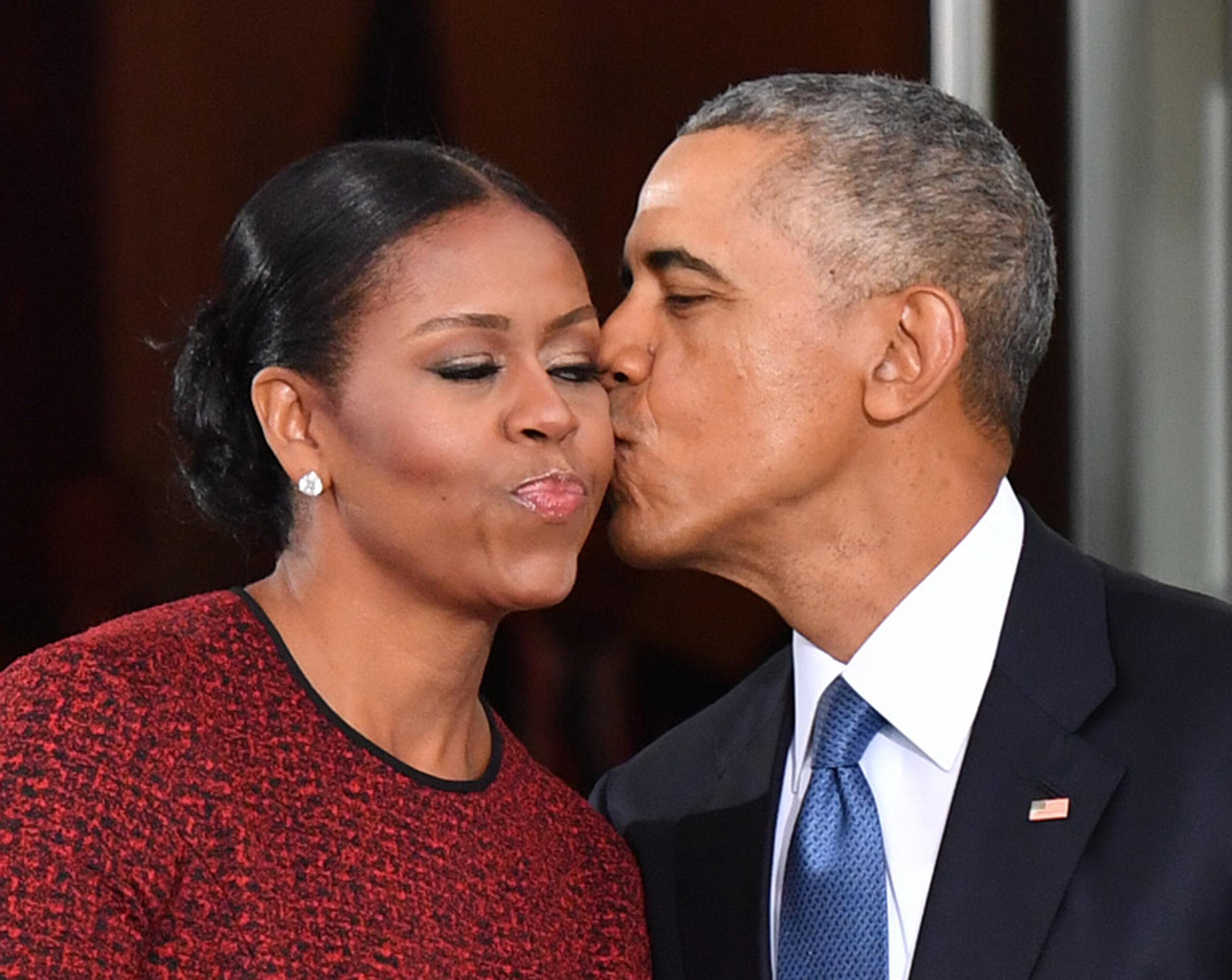 President Barack Obama kisses his wife Michelle on the cheek