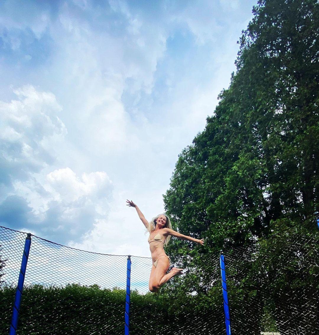 Paulina Porizkova in a gold bikini