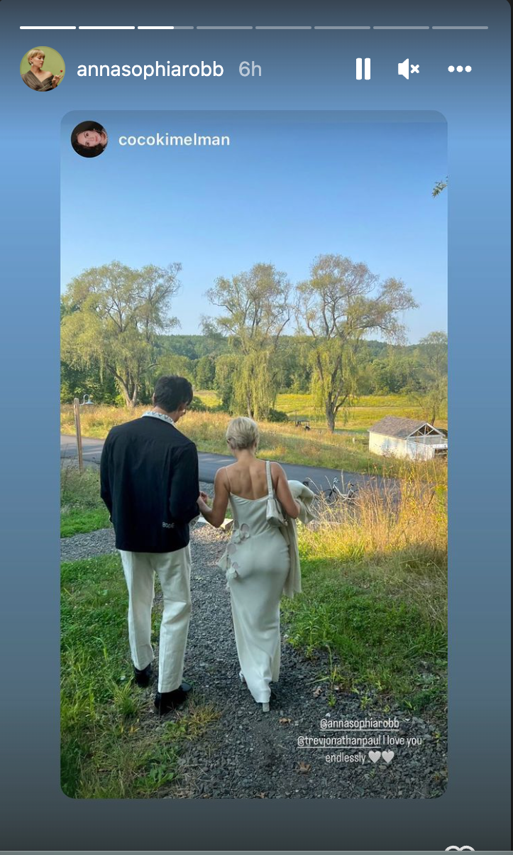 AnnaSophia Robb and Trevor Paul walking near the water