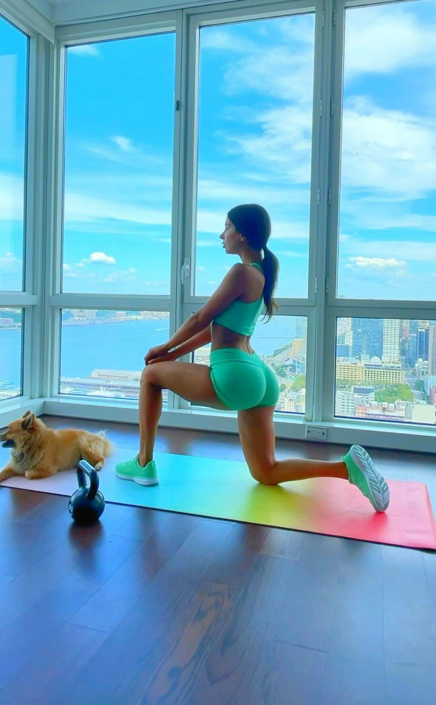 Jen Selter works out in a teal workout set 