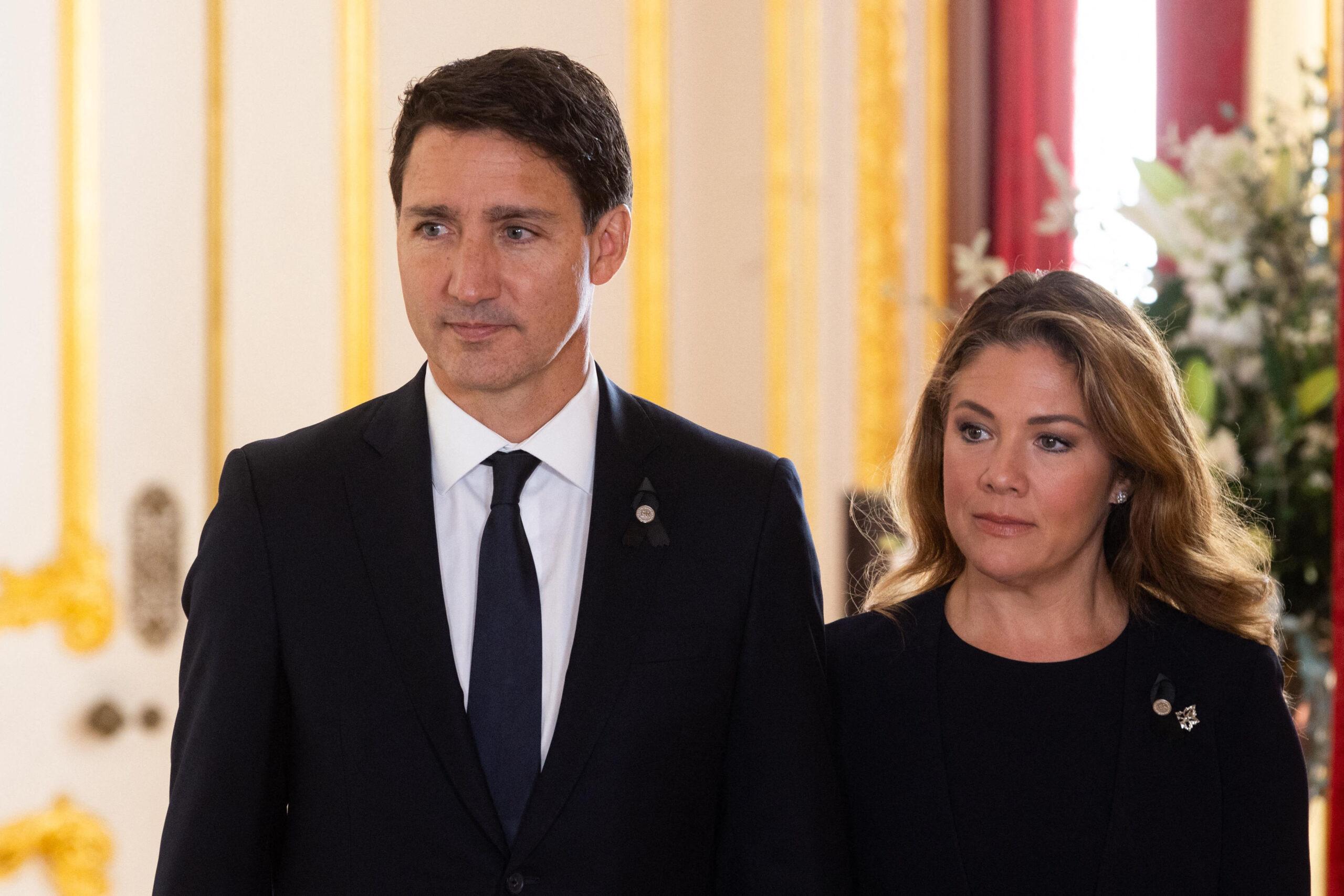 Prime Minister of Canada Justin Trudeau and his wife Sophe Trudeau sign a book of condolence at Lancaster House in London following the death of Queen Elizabeth II