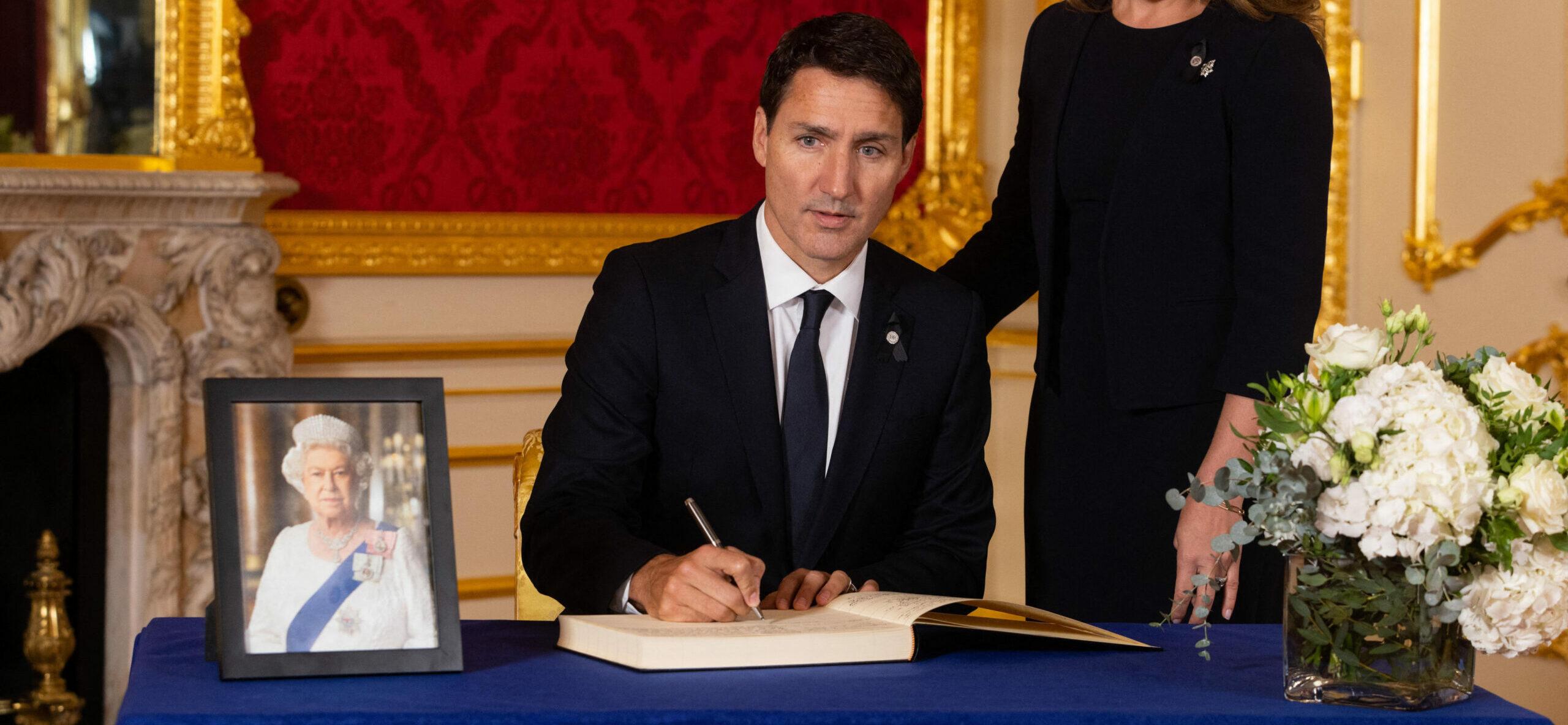 Prime Minister of Canada Justin Trudeau and his wife Sophe Trudeau sign a book of condolence at Lancaster House in London following the death of Queen Elizabeth II