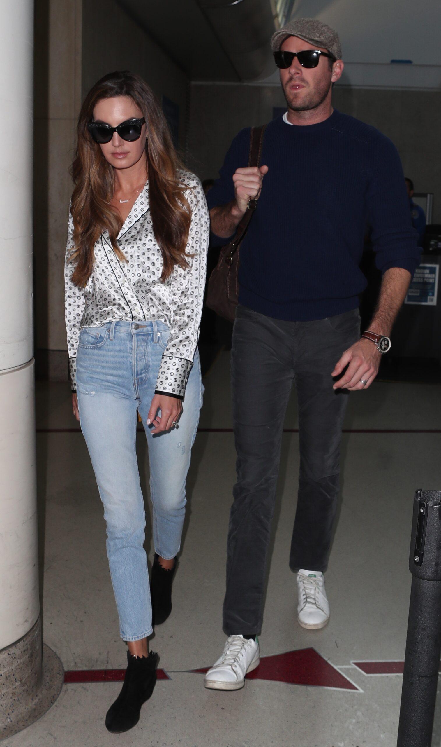 Armie Hammer arrives back to Los Angles with wife Elizabeth Chambers