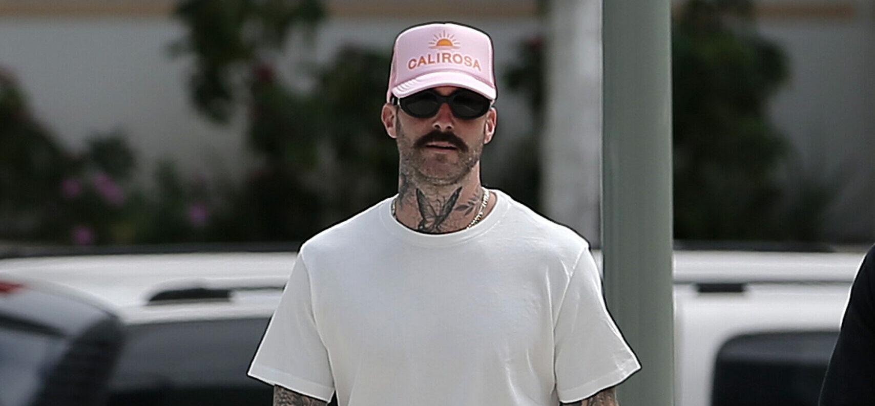 Adam Levine shows off his unique style as he takes a walk in Miami