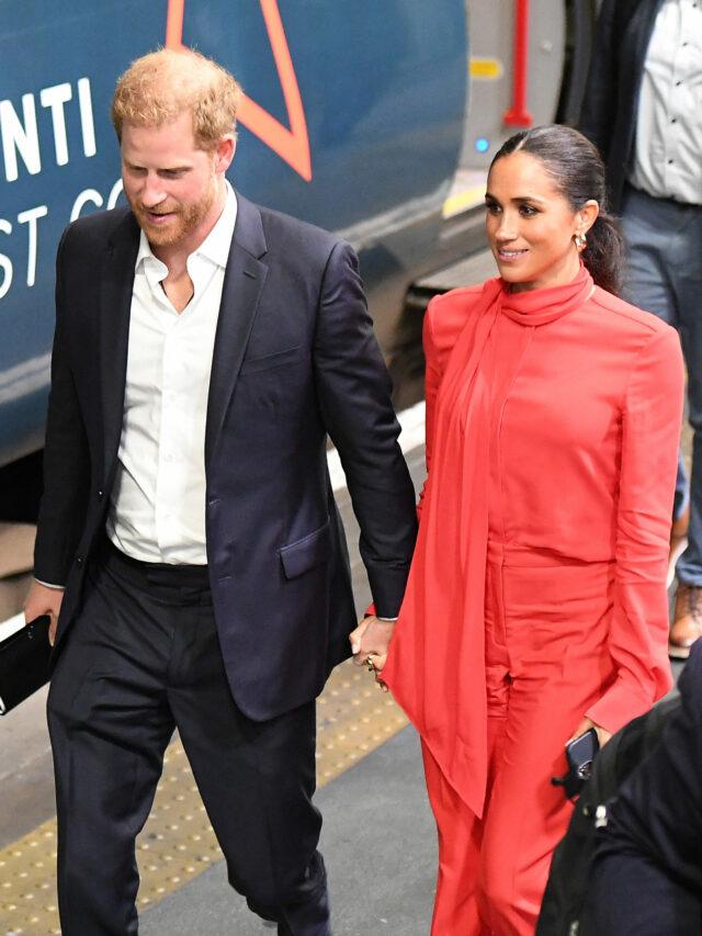 Prince Harry and Meghan Markle at Euston Station on a train from Manchester, having attended the One Young World summit